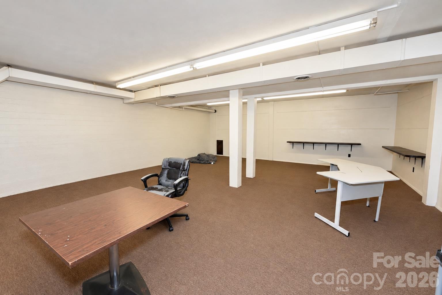 Basement area of Martial Arts side. 1,950 sq. ft. with 2 access areas directly to the street or inside access from the Main Level. - 111/113 E Water Street, Statesville