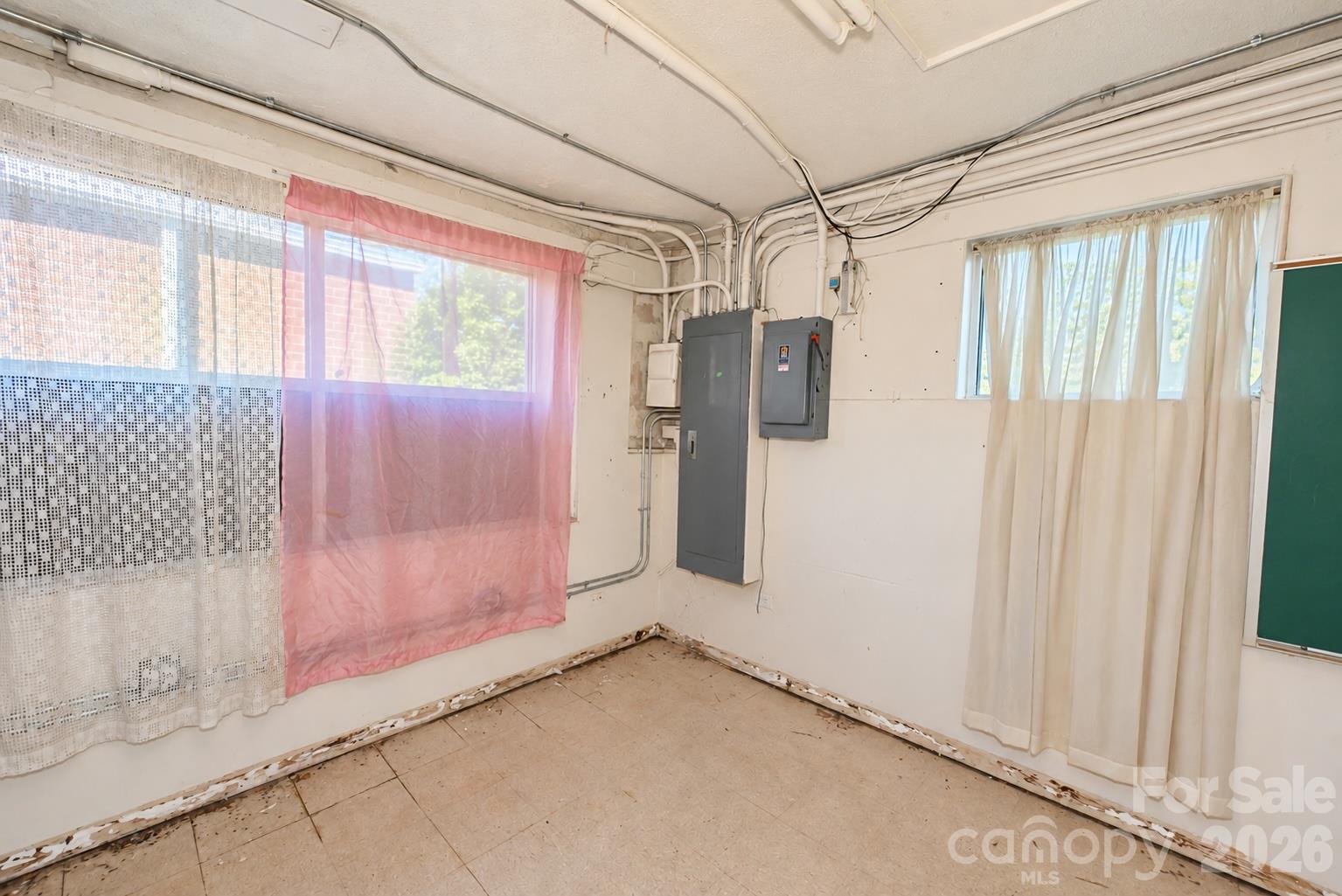 Basement area of Martial Arts side. 1,950 sq. ft. with 2 access areas directly to the street or inside access from the Main Level. - 111/113 E Water Street, Statesville
