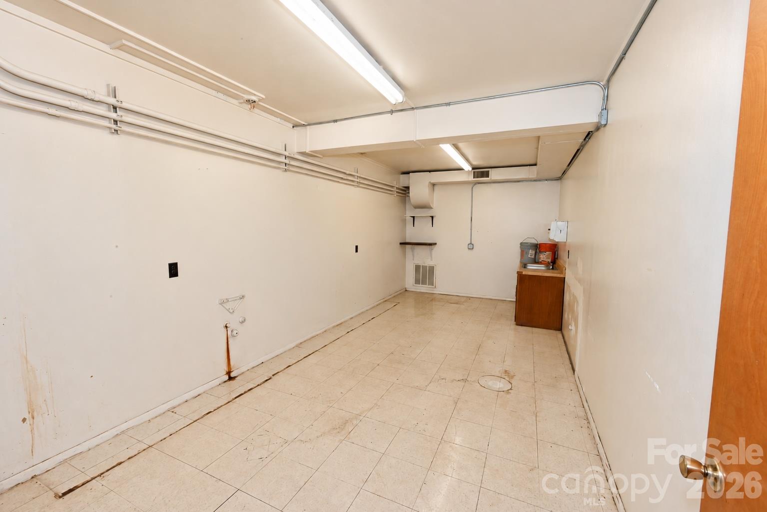 Basement area of Martial Arts side. 1,950 sq. ft. with 2 access areas directly to the street or inside access from the Main Level. - 111/113 E Water Street, Statesville