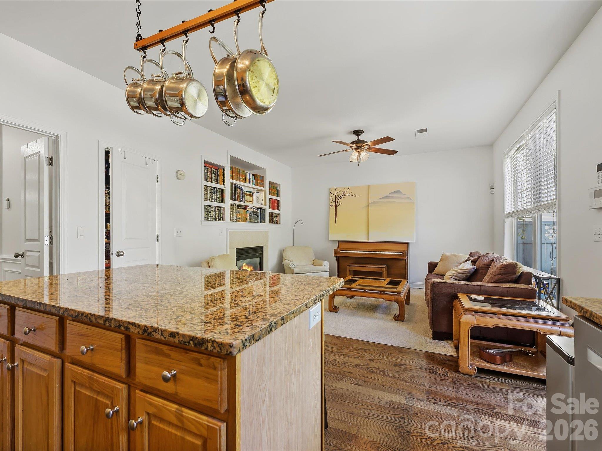 The spacious kitchen opens seamlessly to the great room, creating an inviting open-concept layout ideal for everyday living and entertaining. - 11732 Windy Mist Way, Huntersville
