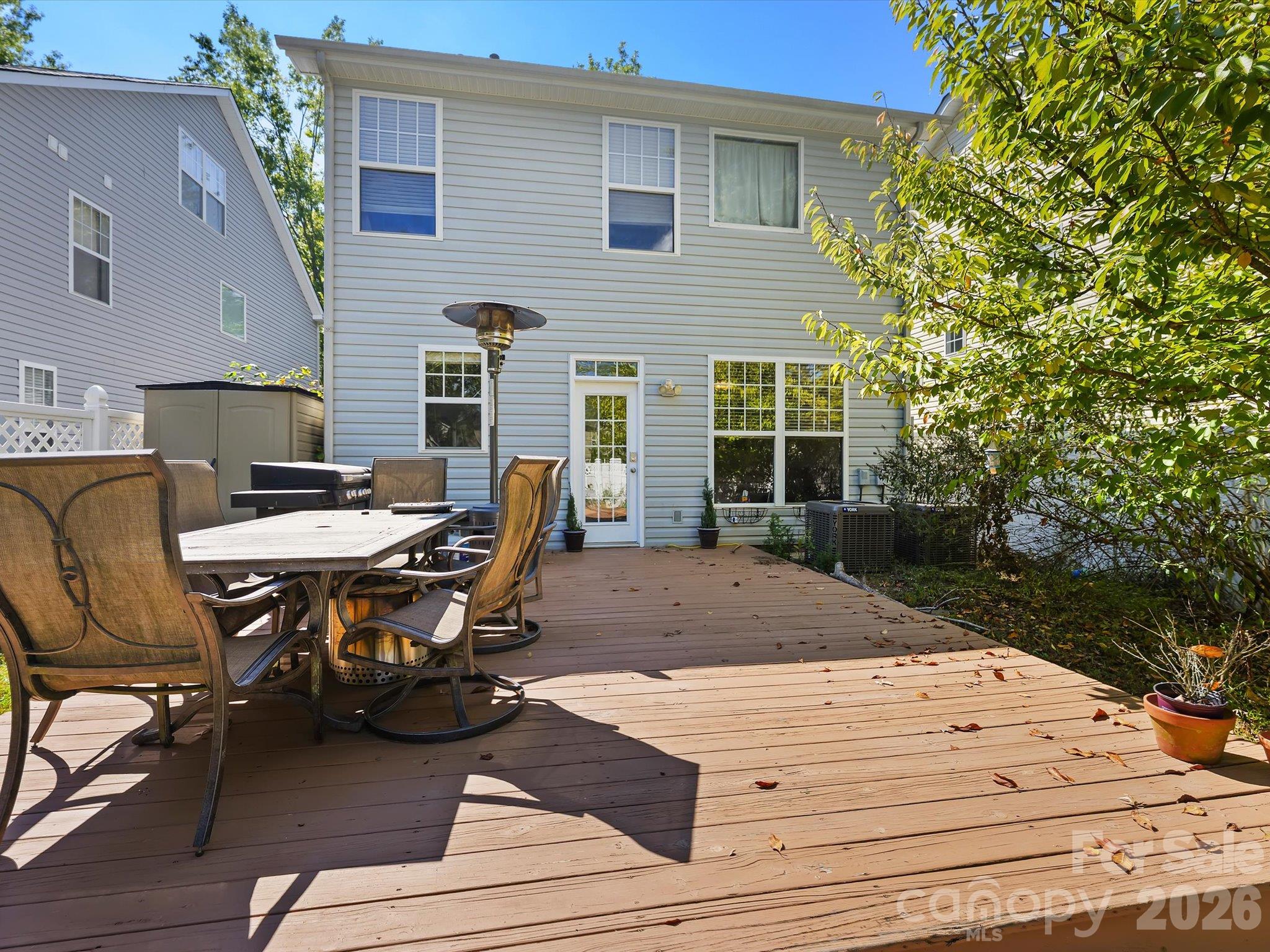 A spacious back deck provides ample room for outdoor dining, entertaining, and relaxing in the private backyard setting. - 11732 Windy Mist Way, Huntersville