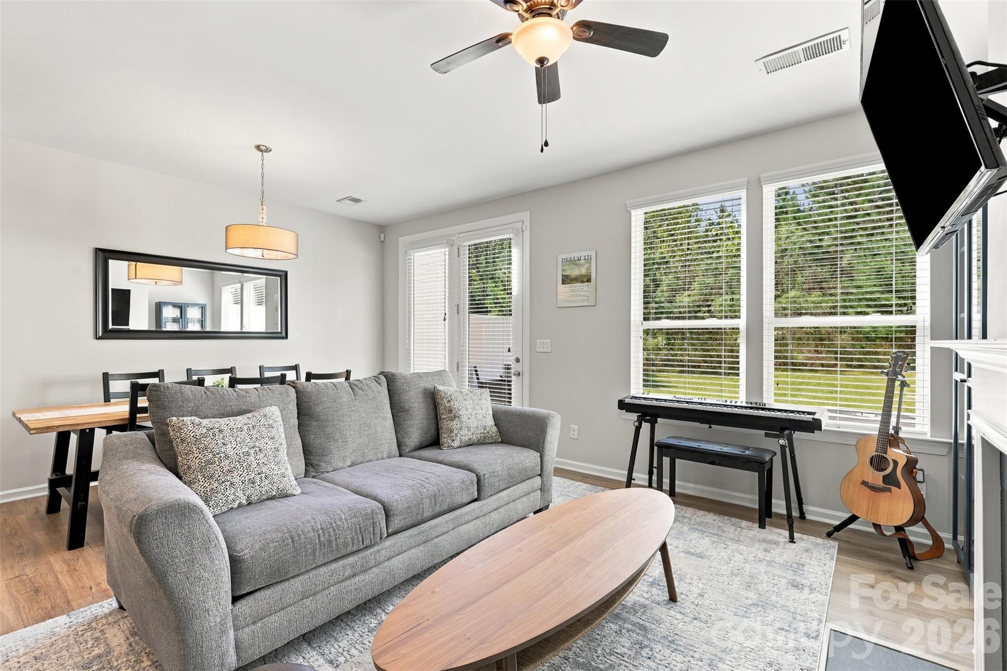 Cozy living room surrounded by a gas fireplace; great natural light! - 1020 Archibald Avenue, Fort Mill
