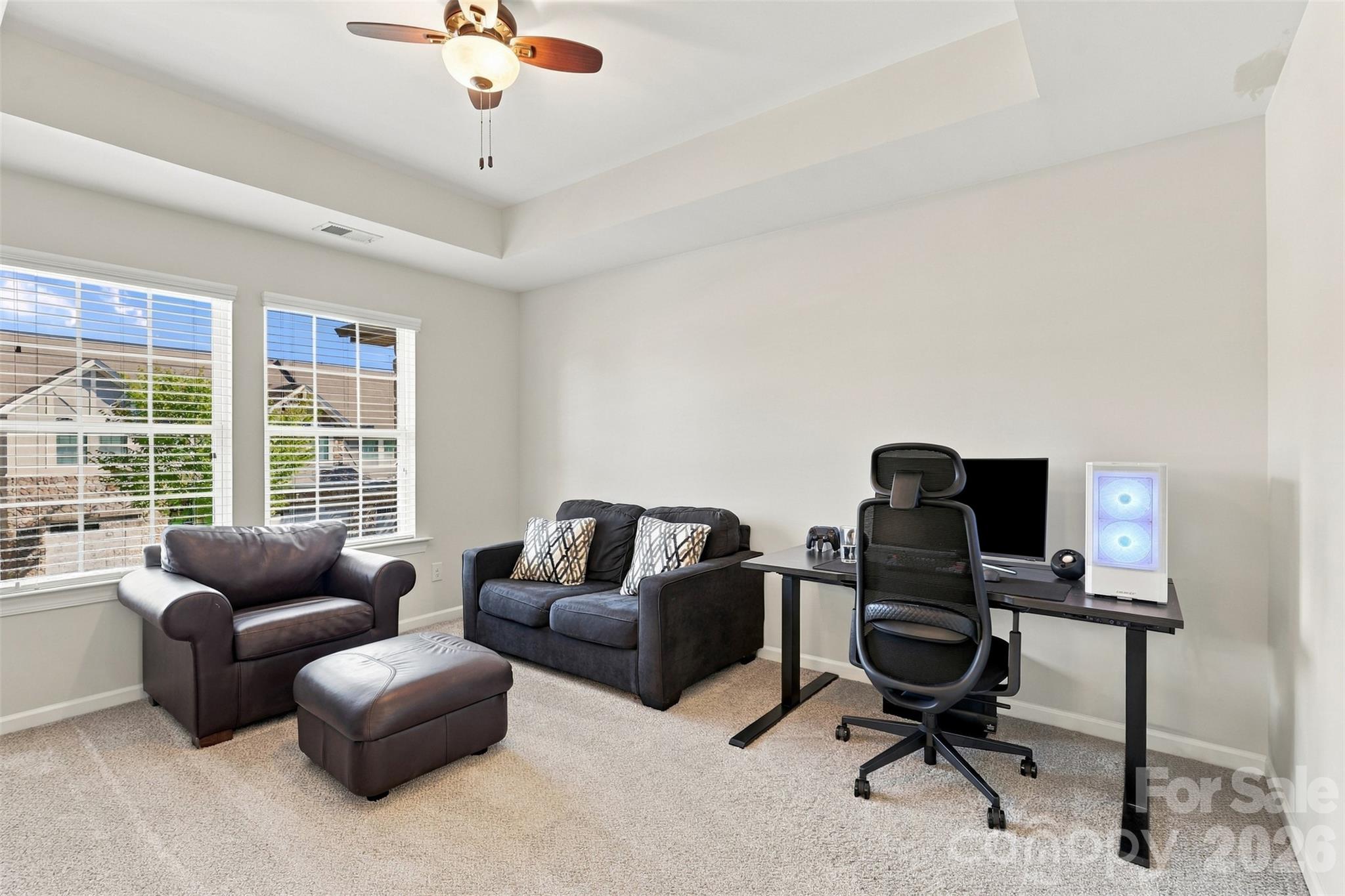 Bedroom 1- tray ceiling, ensuite bath with tiled floors, dual vanity, & tub/shower combo! - 1020 Archibald Avenue, Fort Mill