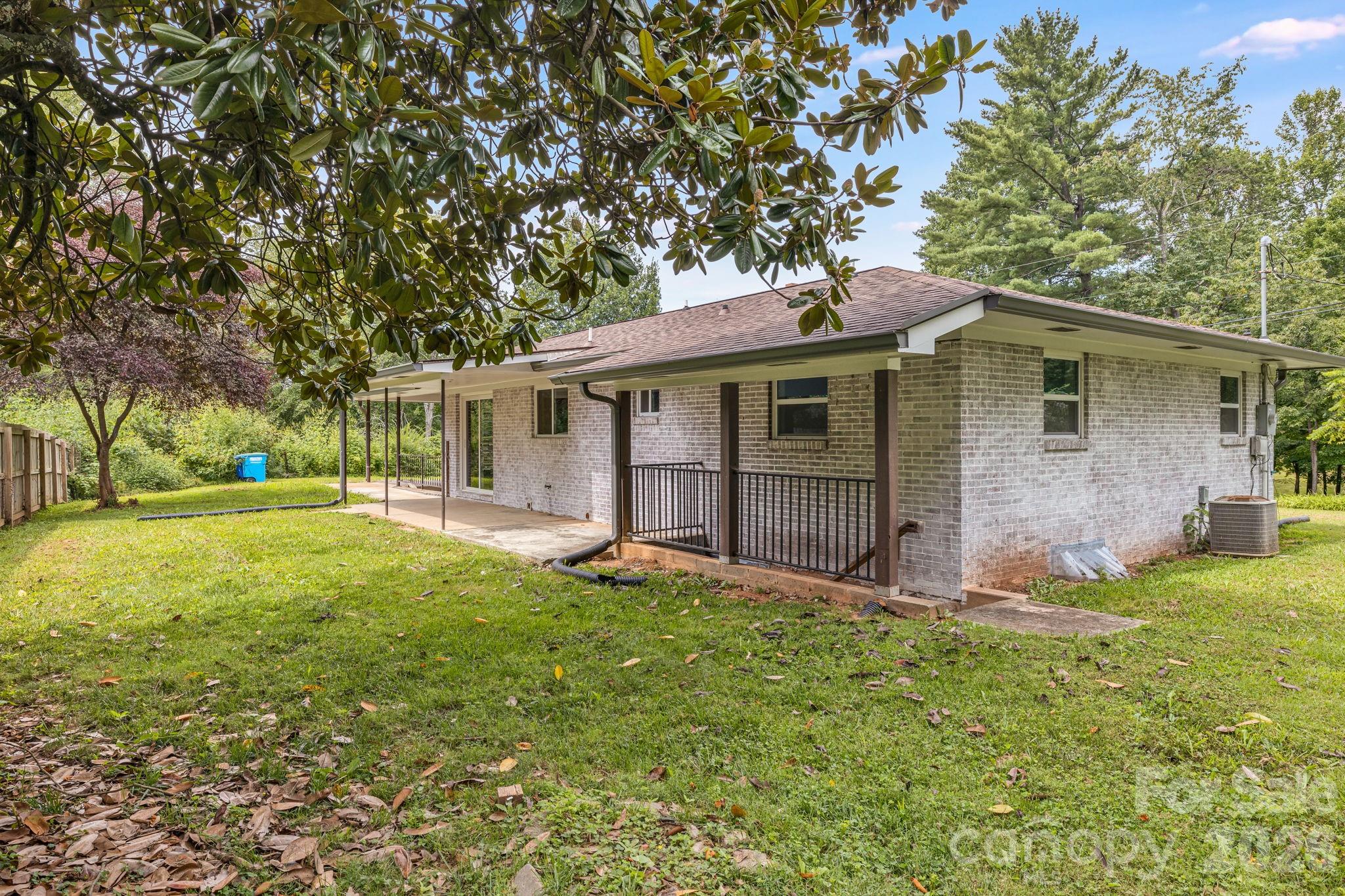outdoor patio and 2nd entrance - 25 Hickory Tree Road, Asheville