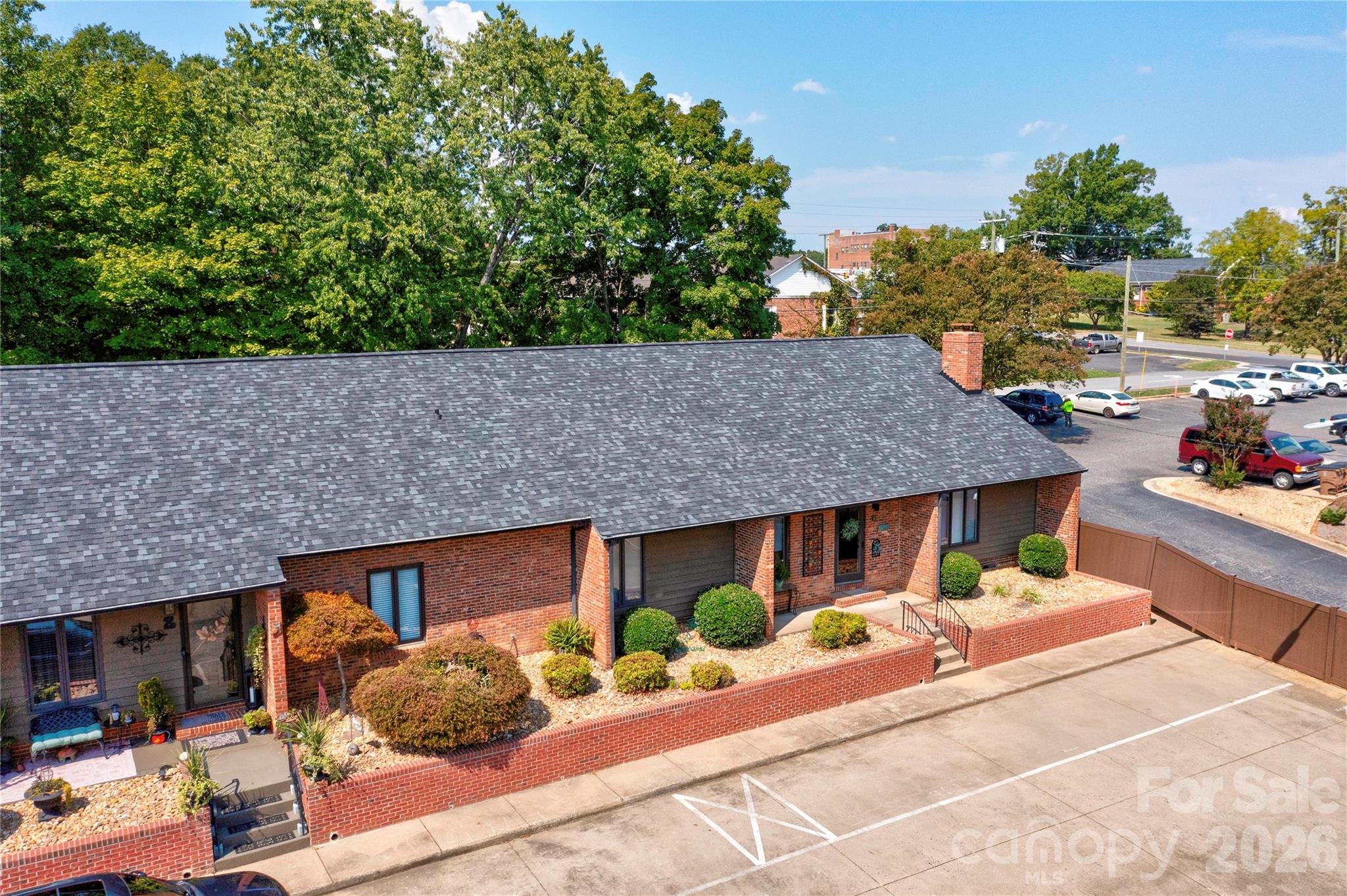 Tucked privately in this quaint townhome village. Easy walk to uptown stores and restaurants. - 301 Pinkney Street, Shelby