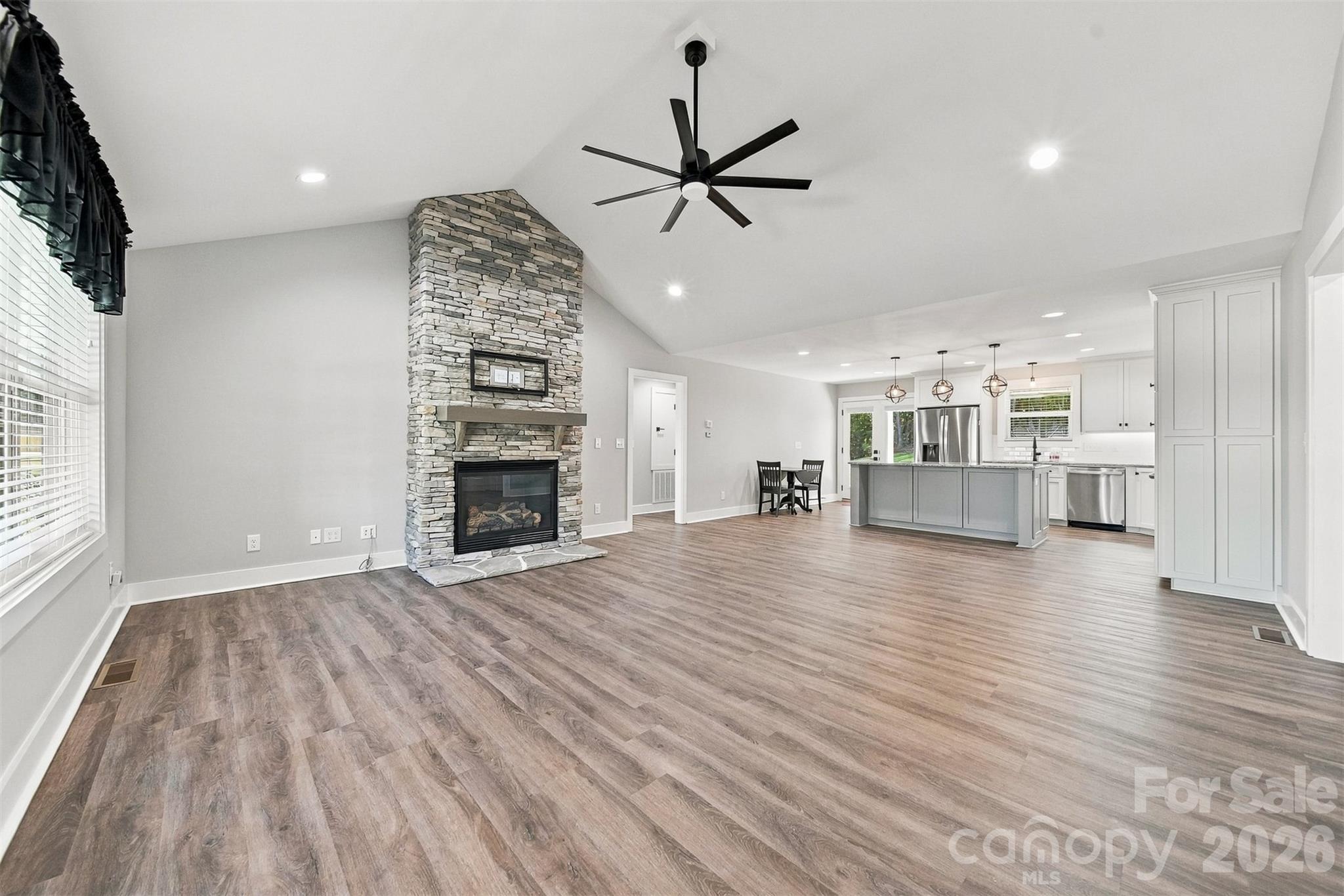 Living Room with Vaulted Ceilings and Fireplace with Gas Logs ( Propane) - 41 Emerson Court, Taylorsville