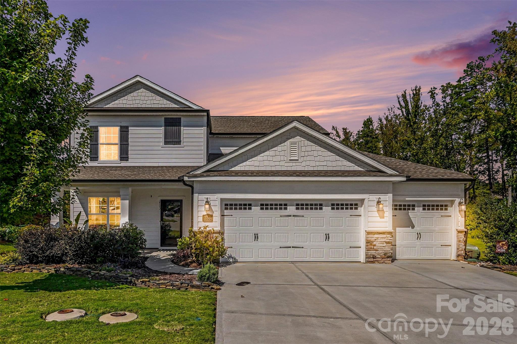 Glowing at twilight, this home makes quite the first impression. - 2703 Wedgewood Court, Denver