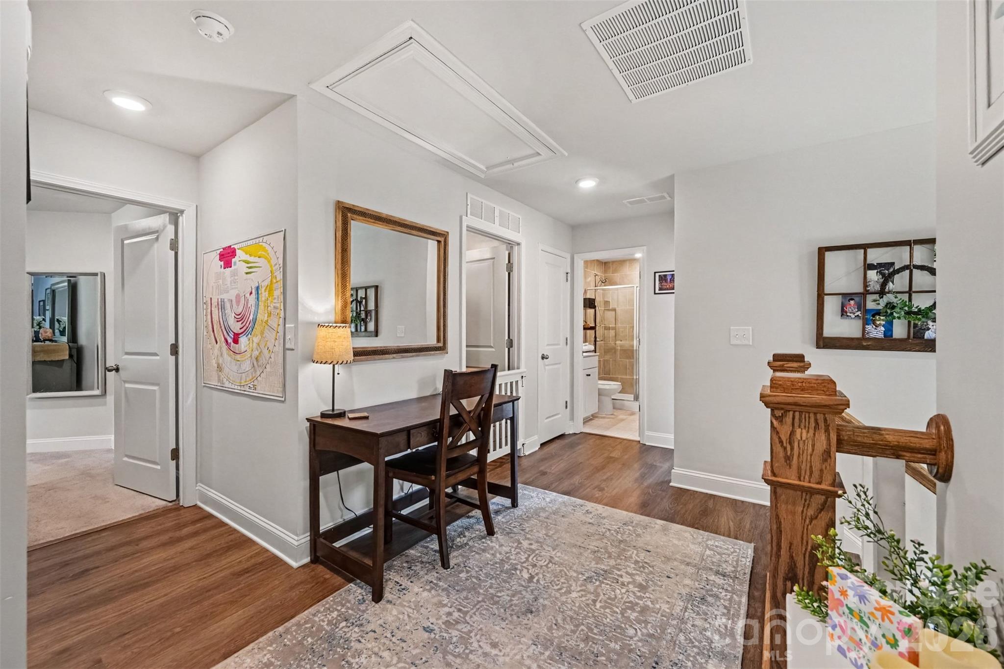 The loft keeps the upstairs open and airy, with the bedrooms just steps away. - 2703 Wedgewood Court, Denver