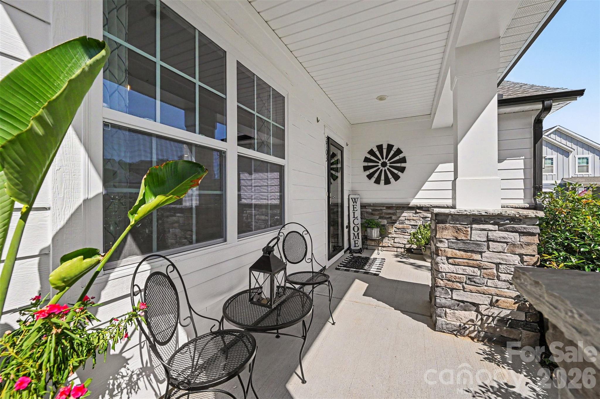 A charming covered front porch, perfect for morning coffee or winding down in the evening. - 2703 Wedgewood Court, Denver