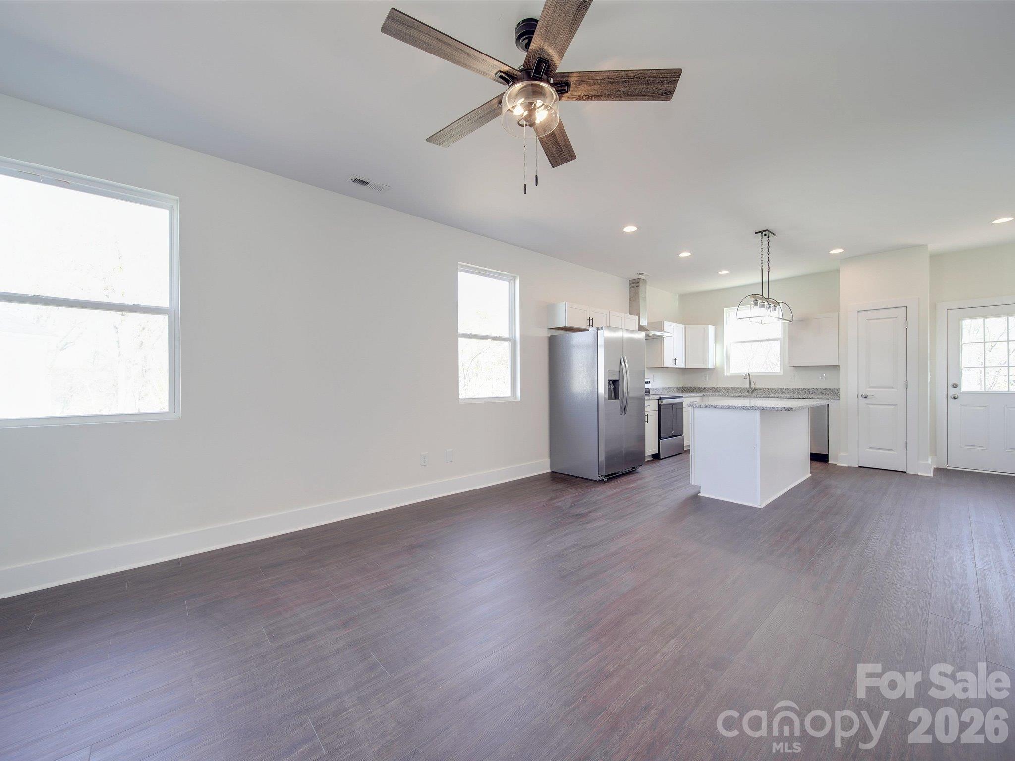 Open floor plan, kitchen and living area - 102 Snyder Court NE, Concord