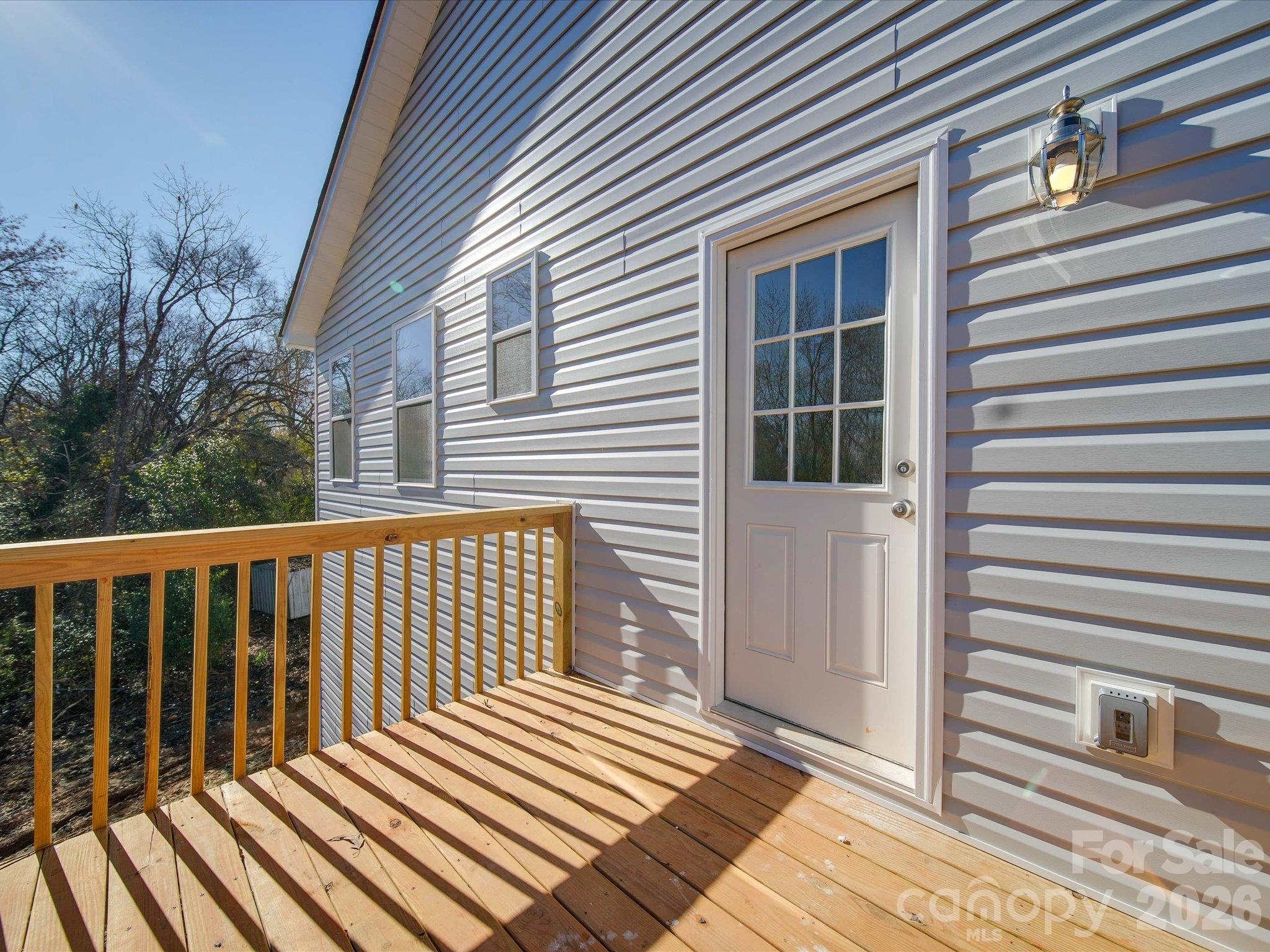Deck off kitchen facing backyard - 102 Snyder Court NE, Concord
