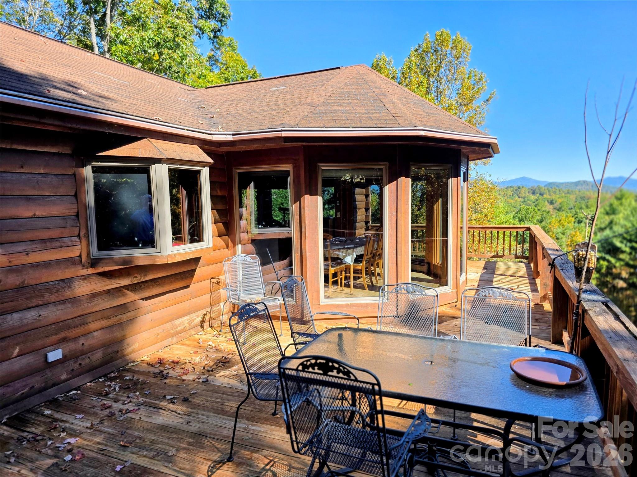 View of main level deck with bow window and dining area step out - 105 Poplar Ridge Lane, Burnsville