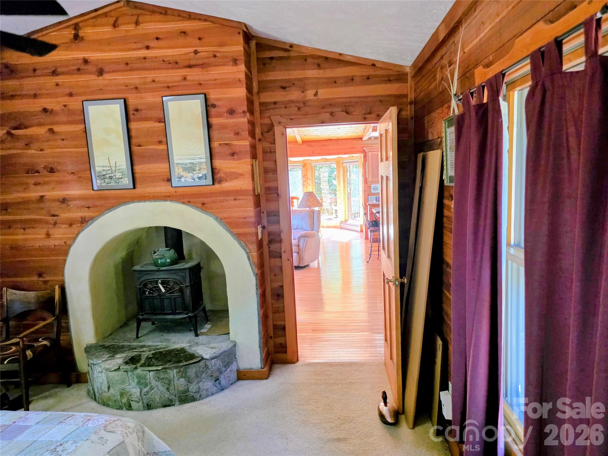 Wood burning stove in the primary bedroom - 105 Poplar Ridge Lane, Burnsville