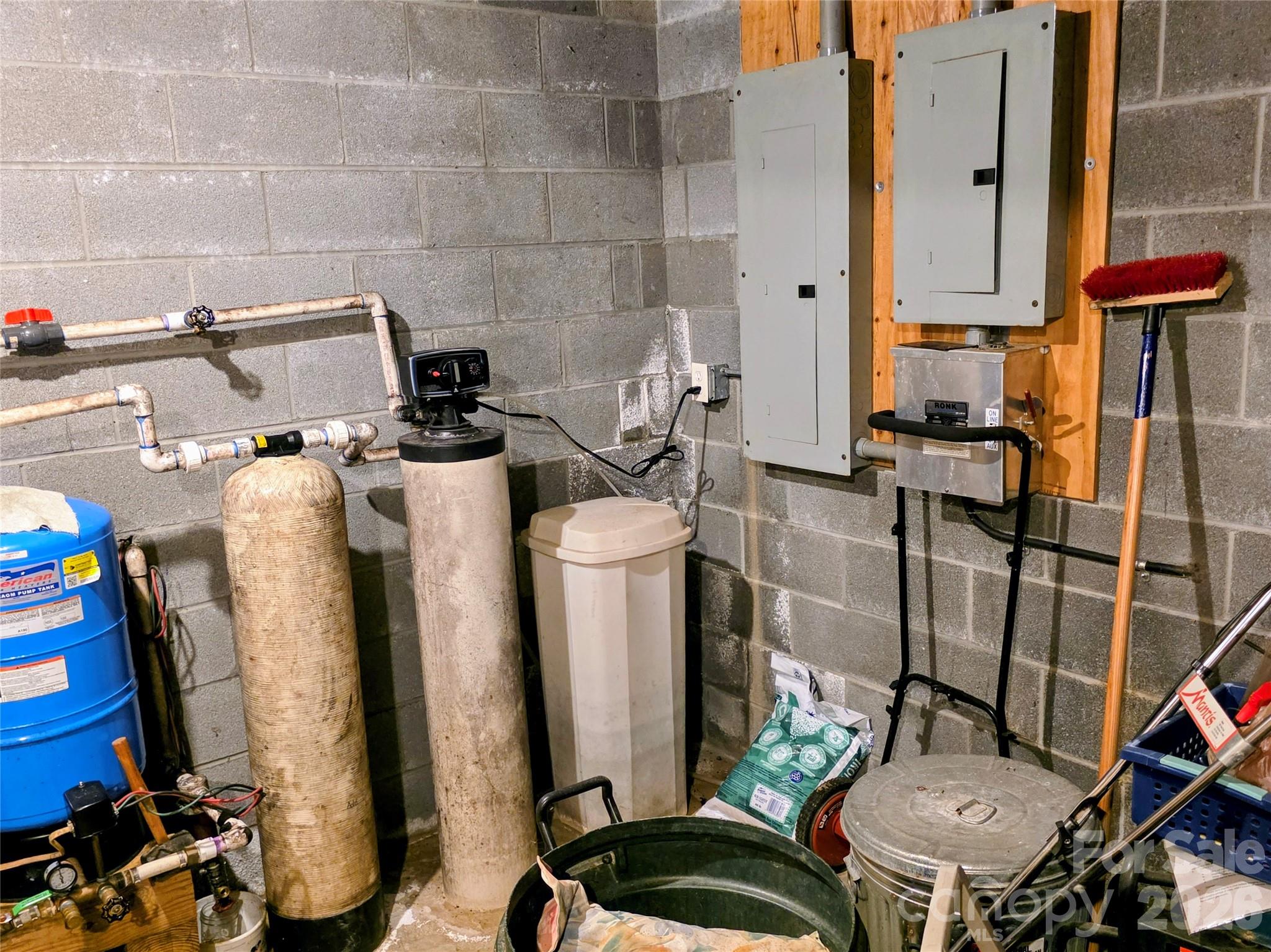 Mechanical room with pressure tank, water softener and breaker panels - 105 Poplar Ridge Lane, Burnsville