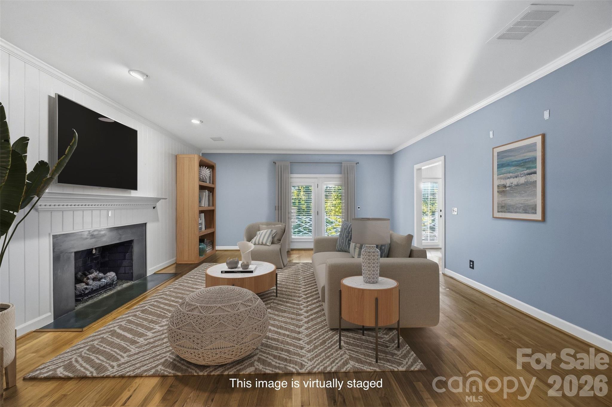 Virtually staged living room with French door leading to the large deck - 185 Appian Way, Shelby