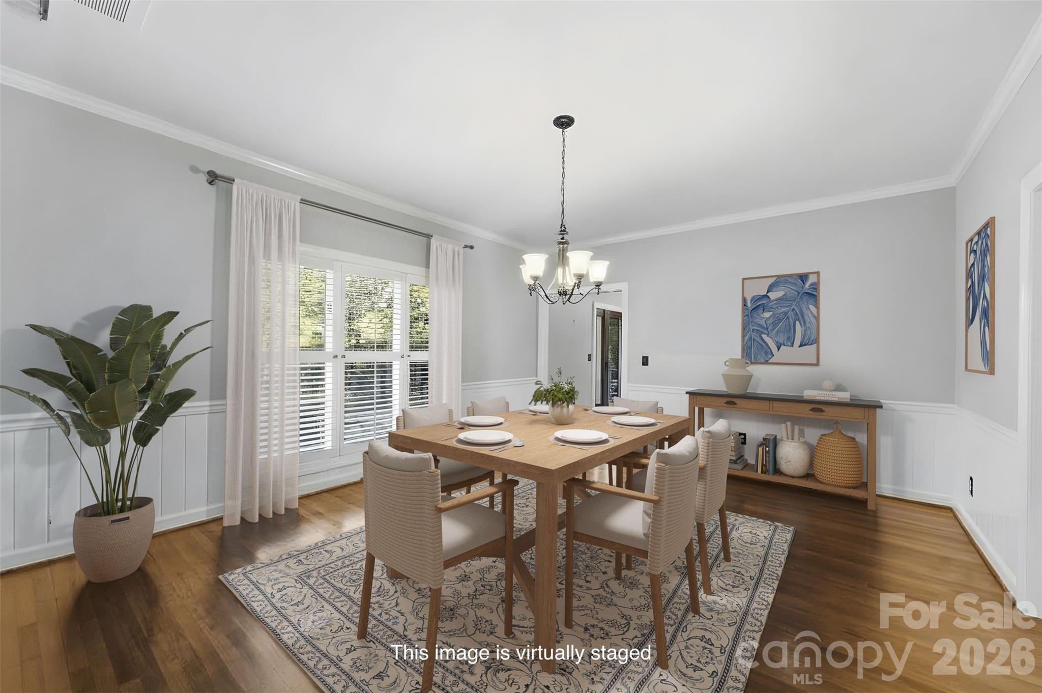 Virtually staged dining room with large window, chair rail, and wainscoting - 185 Appian Way, Shelby