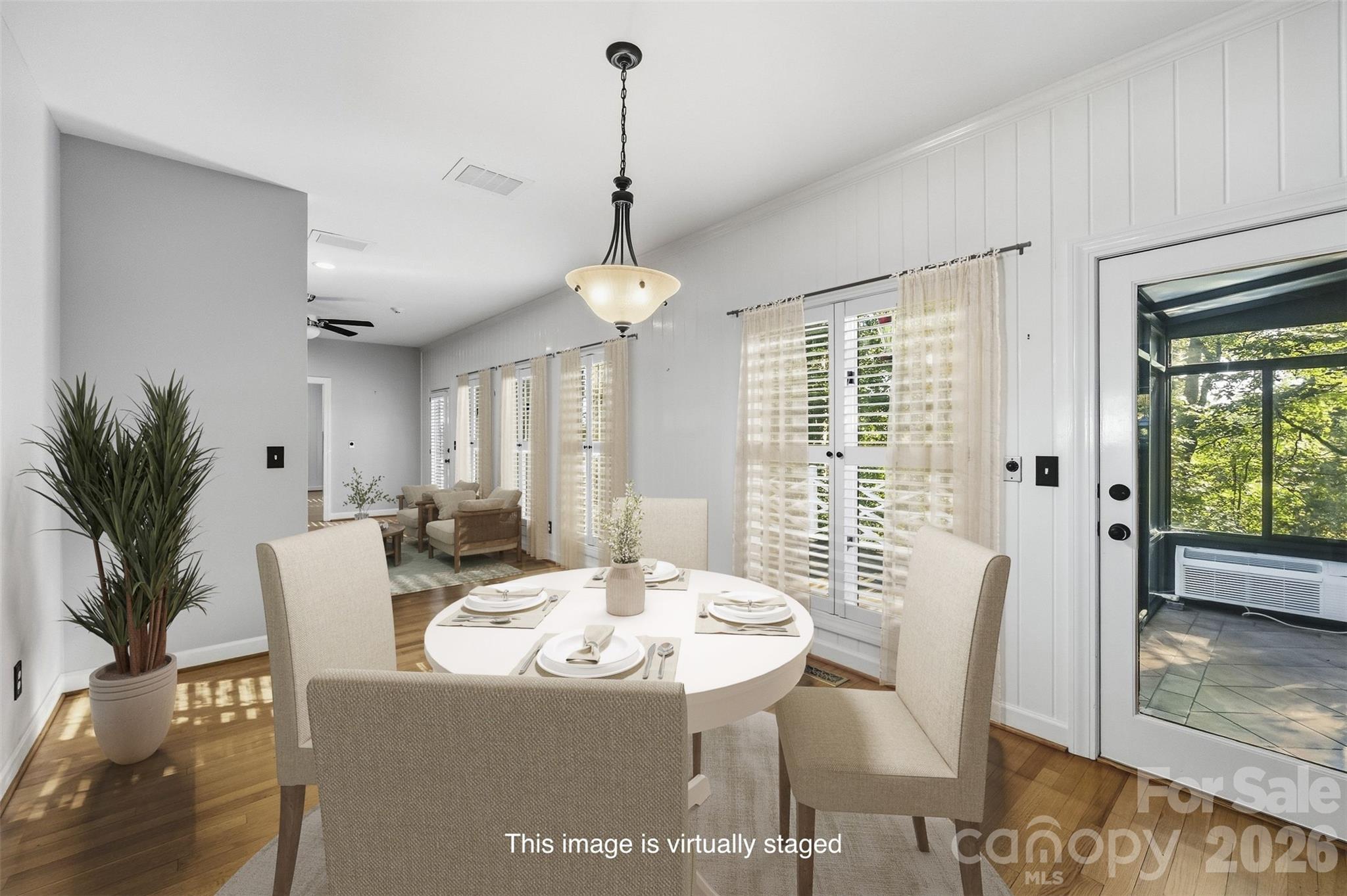 Virtually staged breakfast room has access to the sunroom, 2nd floor staircase, and kitchen! - 185 Appian Way, Shelby