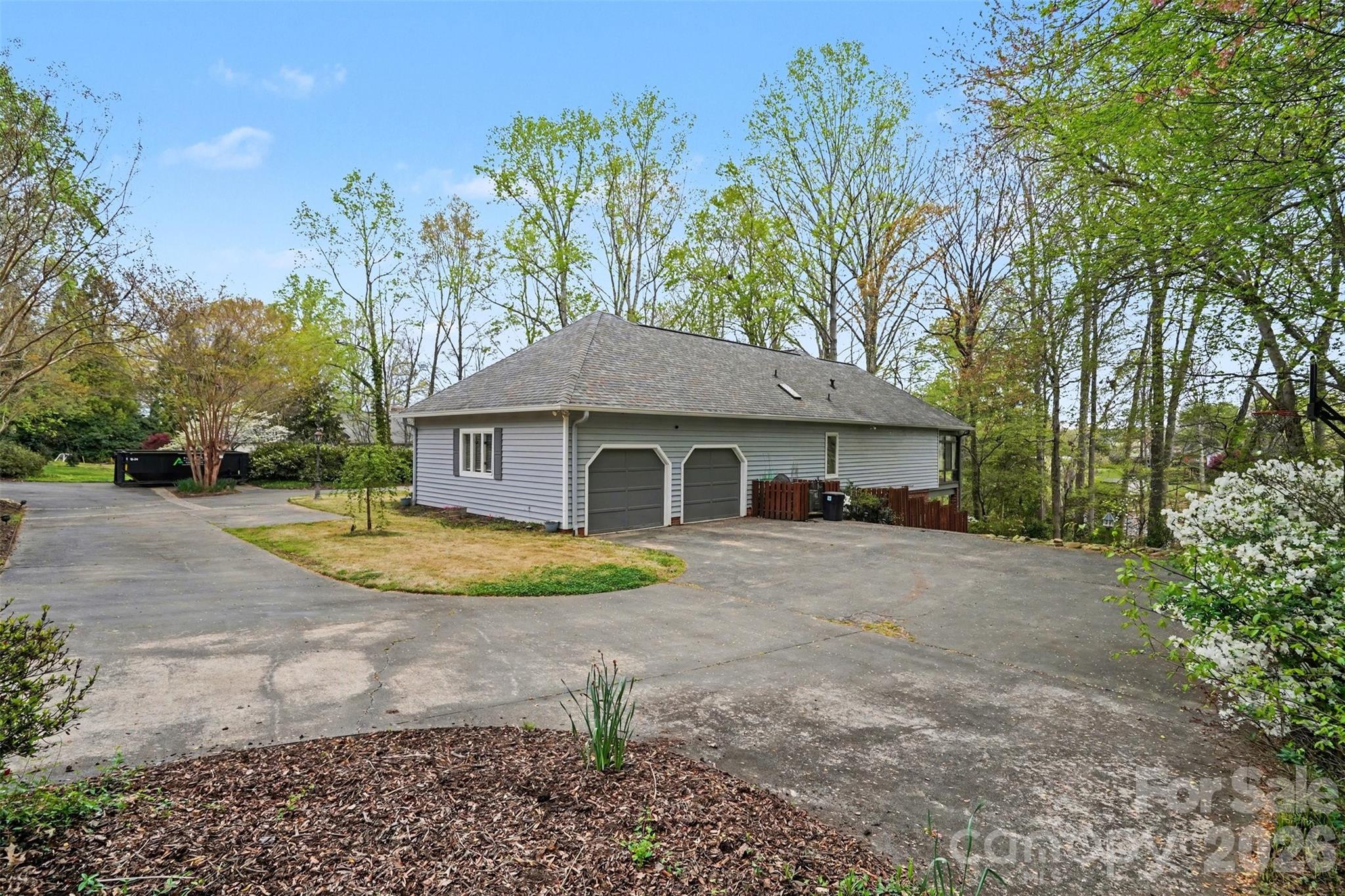 Side garage view of the house--tons of parking and room for projects! - 185 Appian Way, Shelby