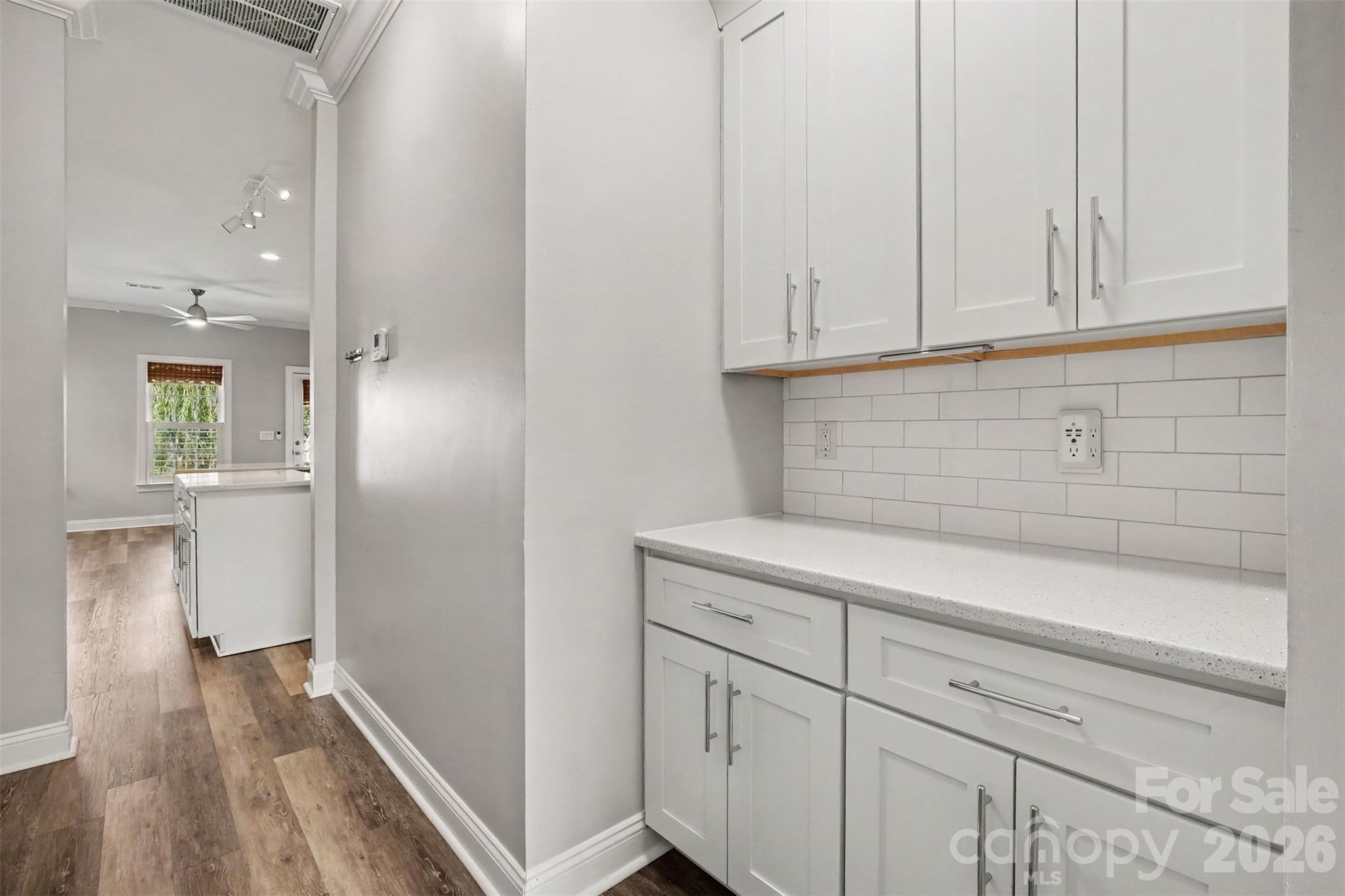 Butler pantry area with extra storage across from it - 1006 Triple Crown Drive, Indian Trail