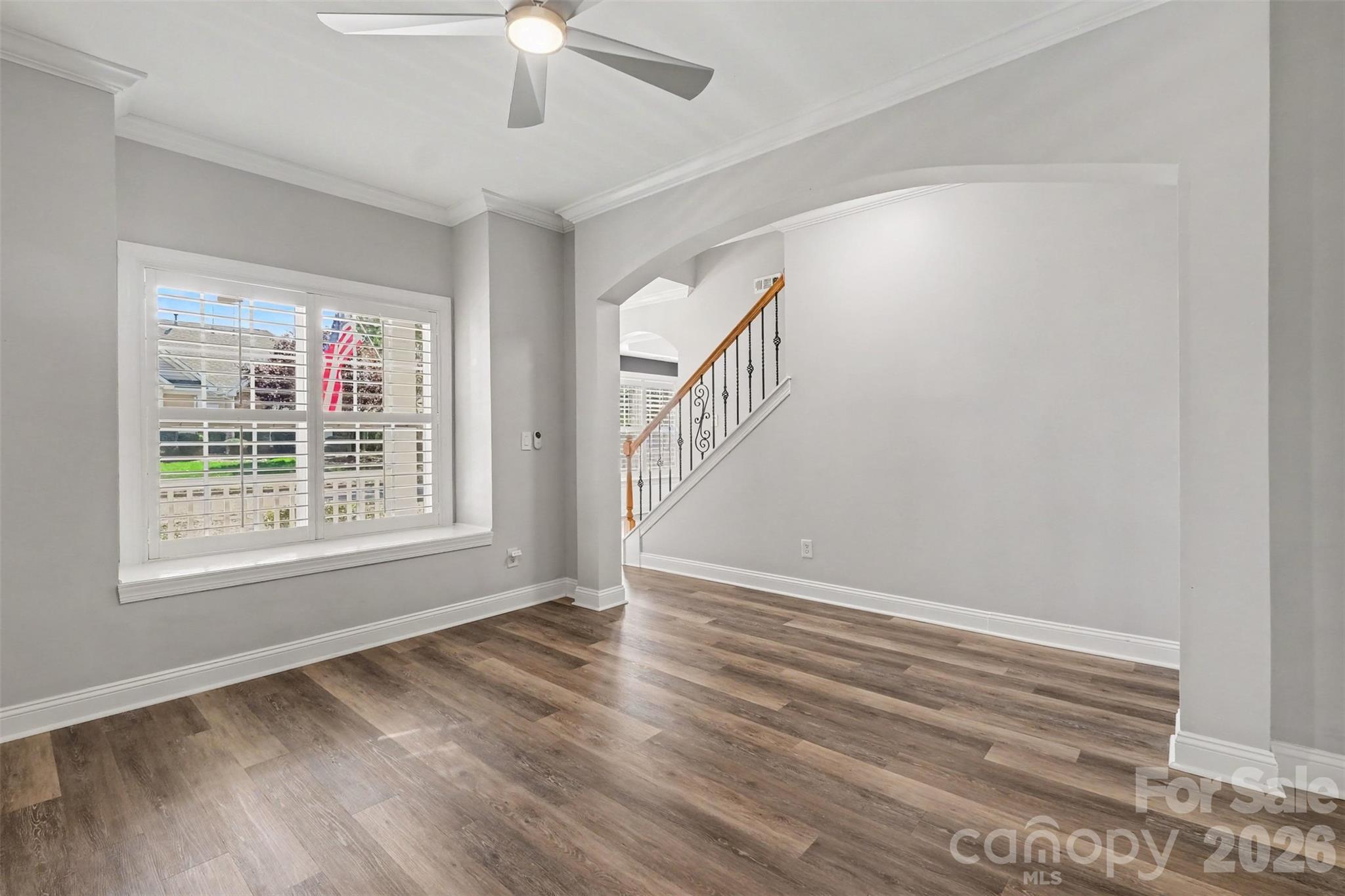 Plantation shutters throughout main level and iron baluster upgrades - 1006 Triple Crown Drive, Indian Trail