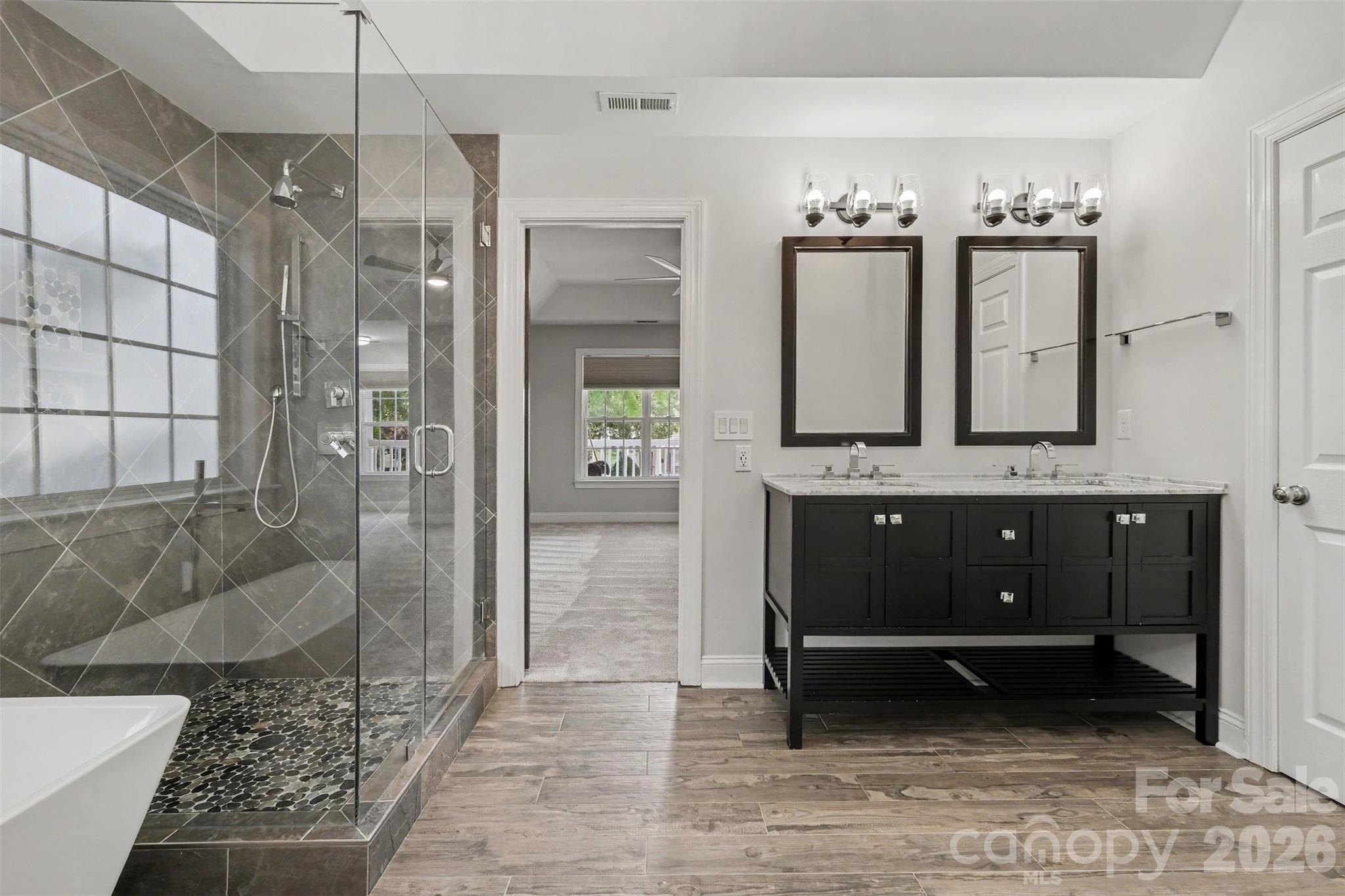 Beautiful ceramic tile flooring and new vanity with fixtures - 1006 Triple Crown Drive, Indian Trail