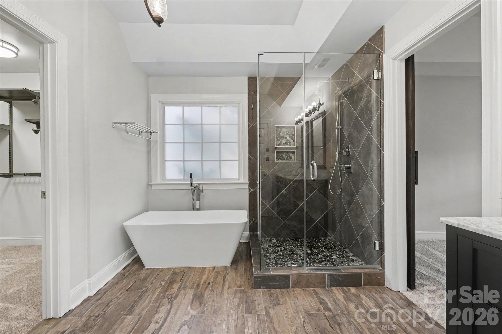 Frameless tiled shower, freestanding tub and even a towel warmer! - 1006 Triple Crown Drive, Indian Trail