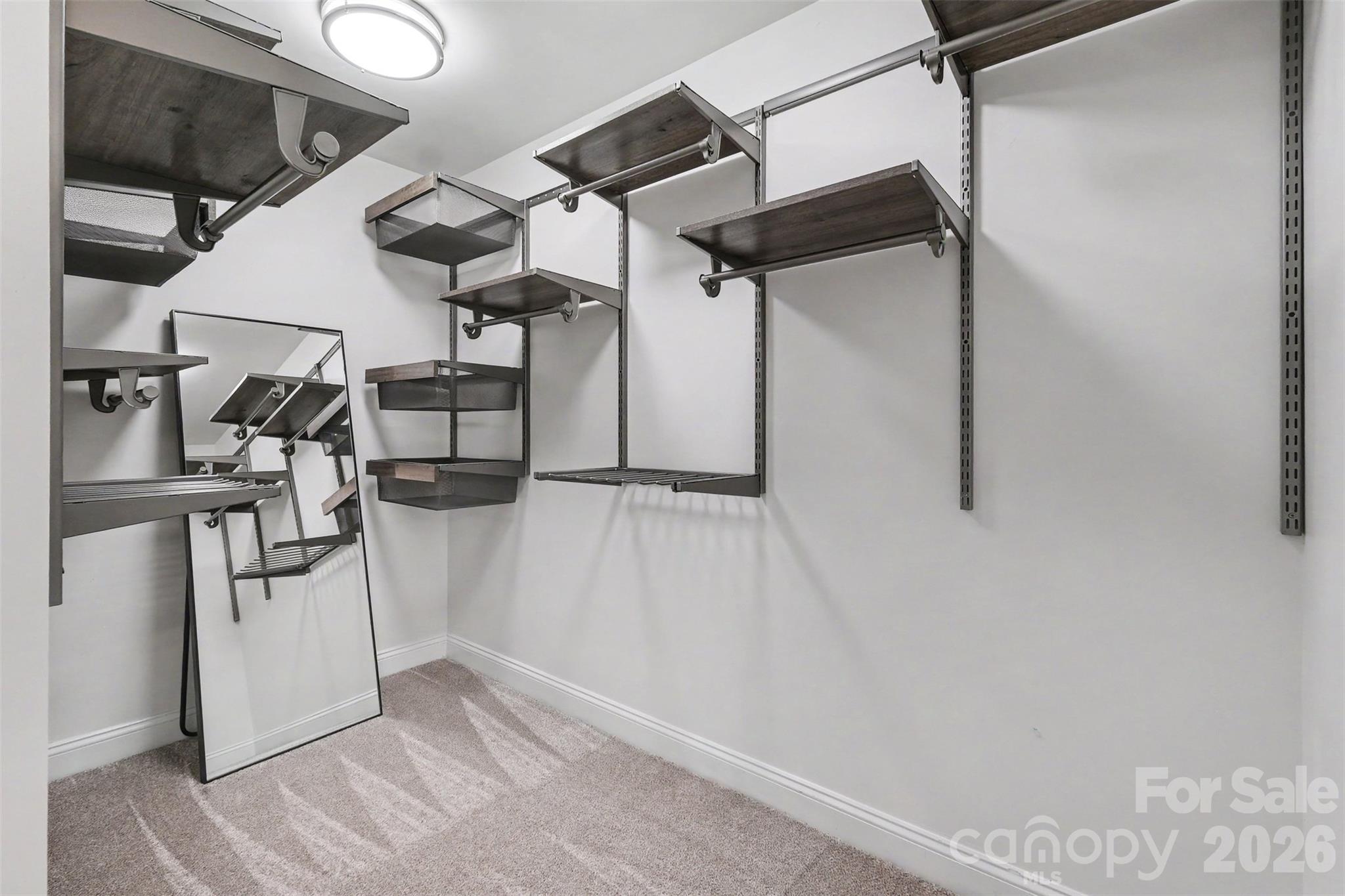Walk-in closet in the primary ensuite - 1006 Triple Crown Drive, Indian Trail