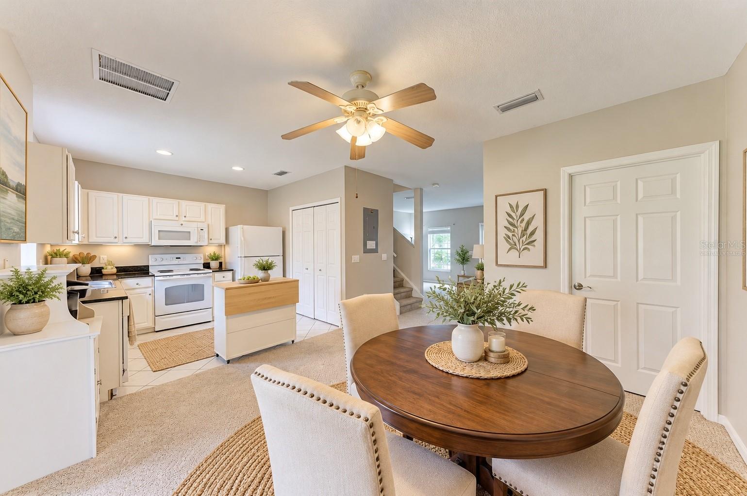 Virtually staged dining and kitchen area perfect for entertaining! - 14745 AMBERJACK TER #1, BRADENTON