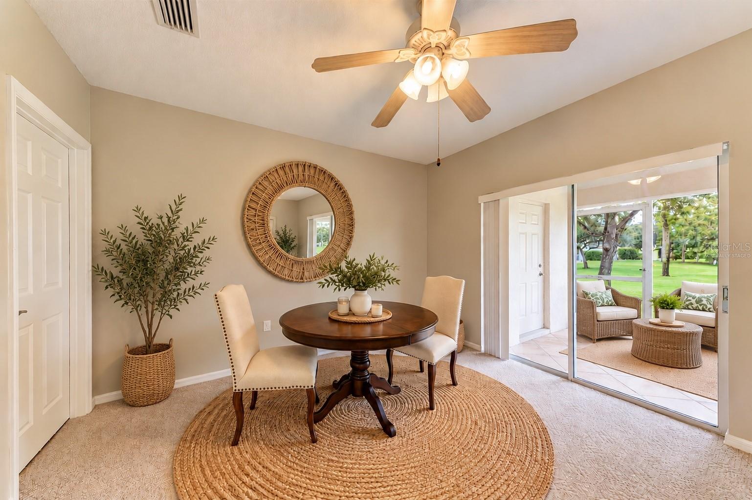 Virtually staged Boho dining and lanai space. - 14745 AMBERJACK TER #1, BRADENTON