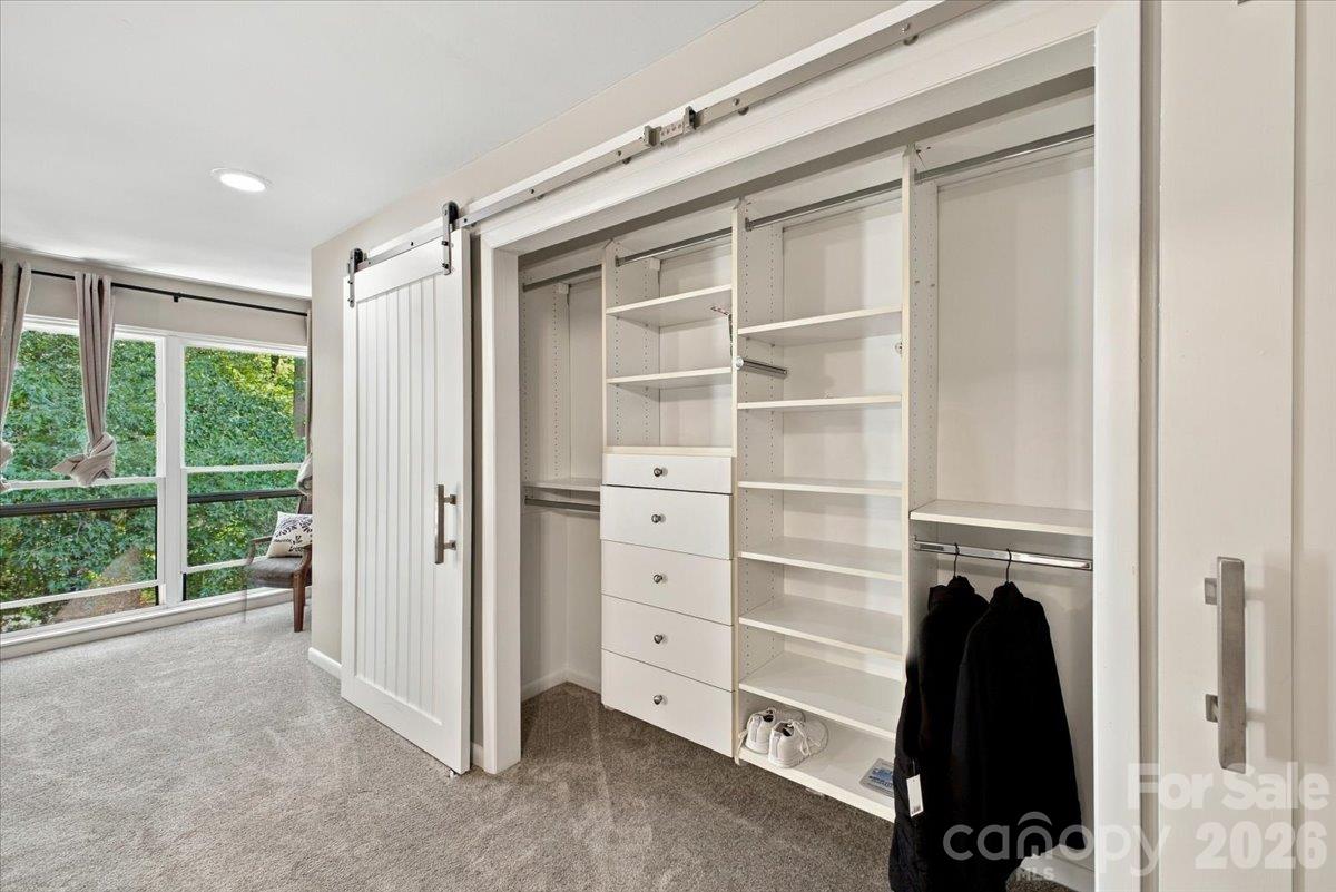 Primary ensuite bedroom with multiple closets - 5805 Sharon Road, Charlotte