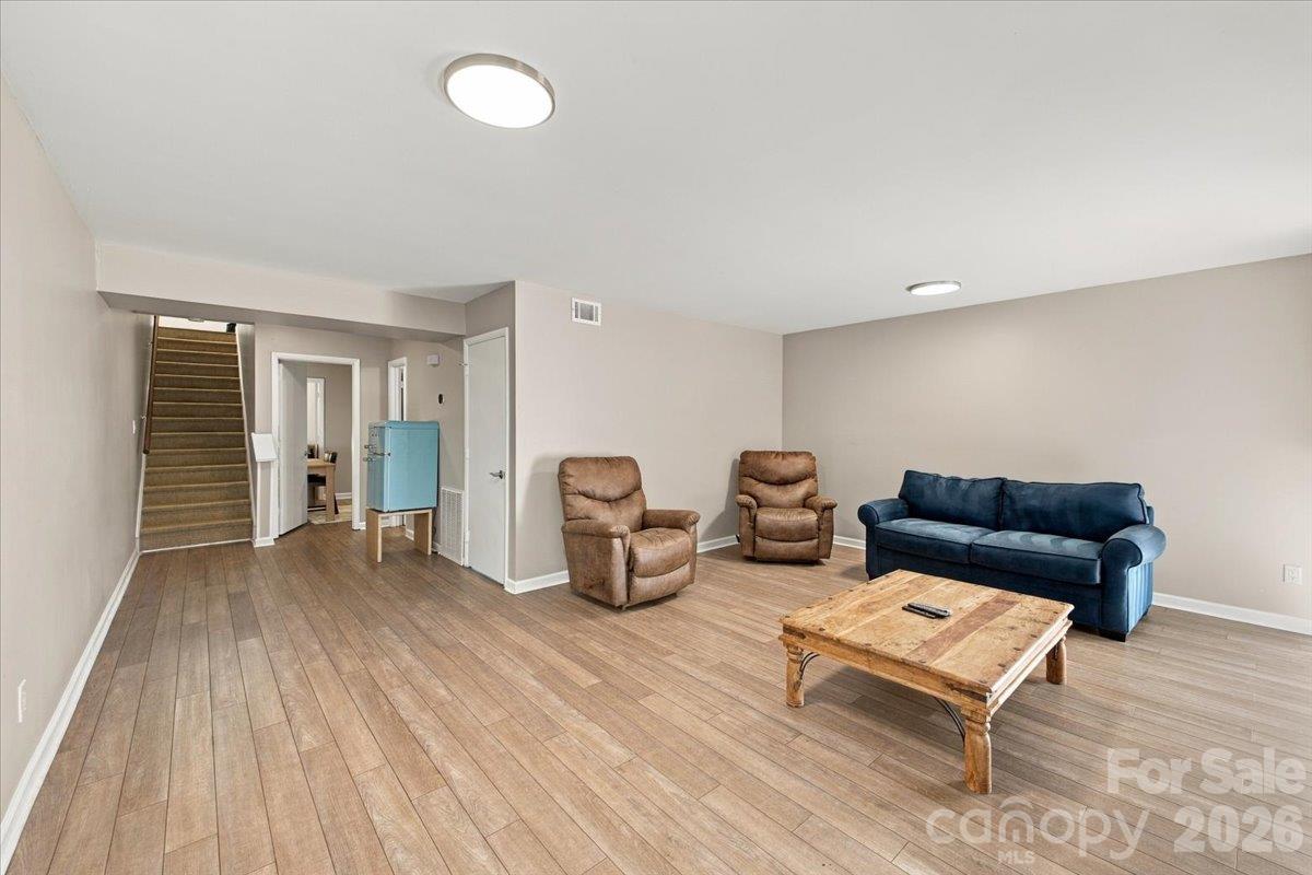 Basement level with open concept living space and bedroom with ensuite - 5805 Sharon Road, Charlotte