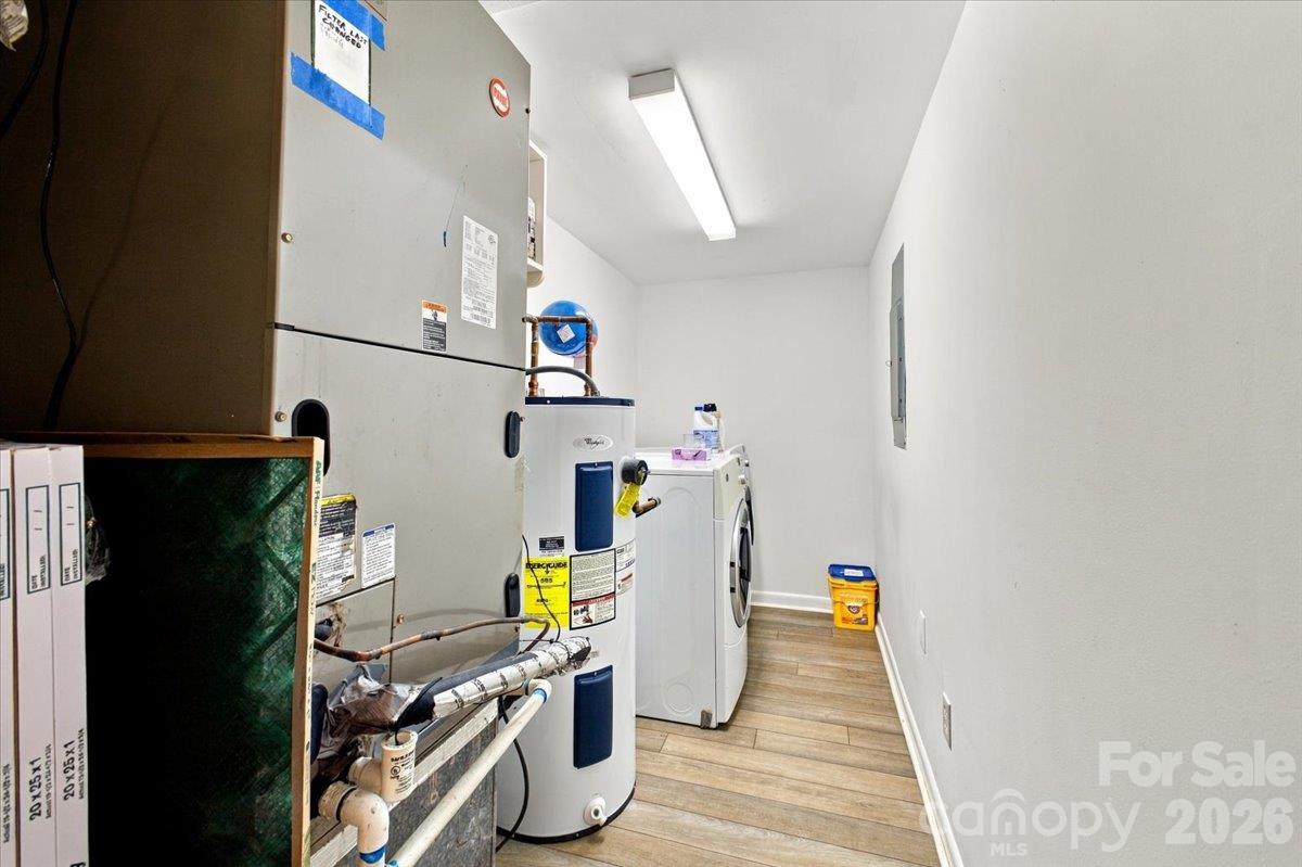 Laundry room with ample space and location of water heater - 5805 Sharon Road, Charlotte