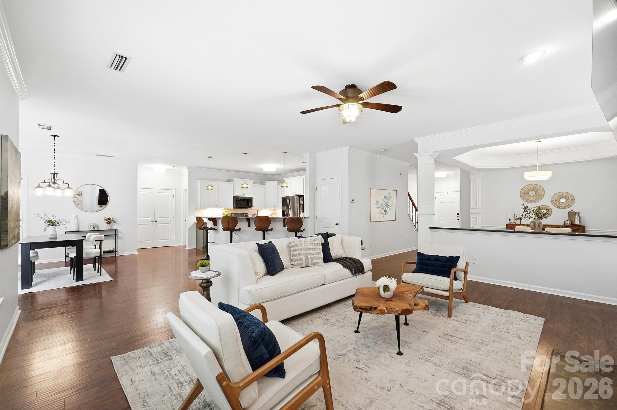 Open concept living room with ceiling fan - 5409 Cotton Top Court, Waxhaw