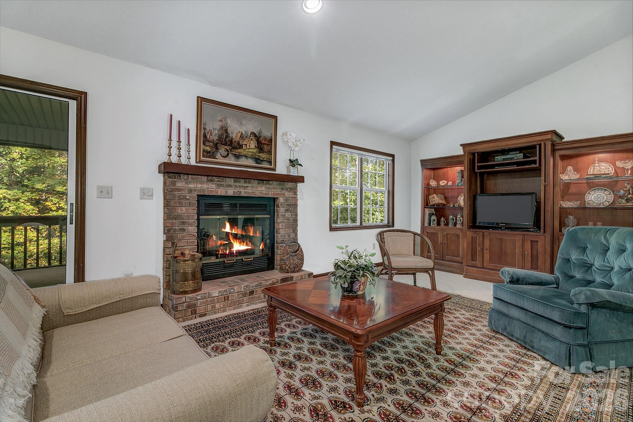 Large living room with vaulted ceilings and a gas fire place - 3111 Essex Path, Hendersonville