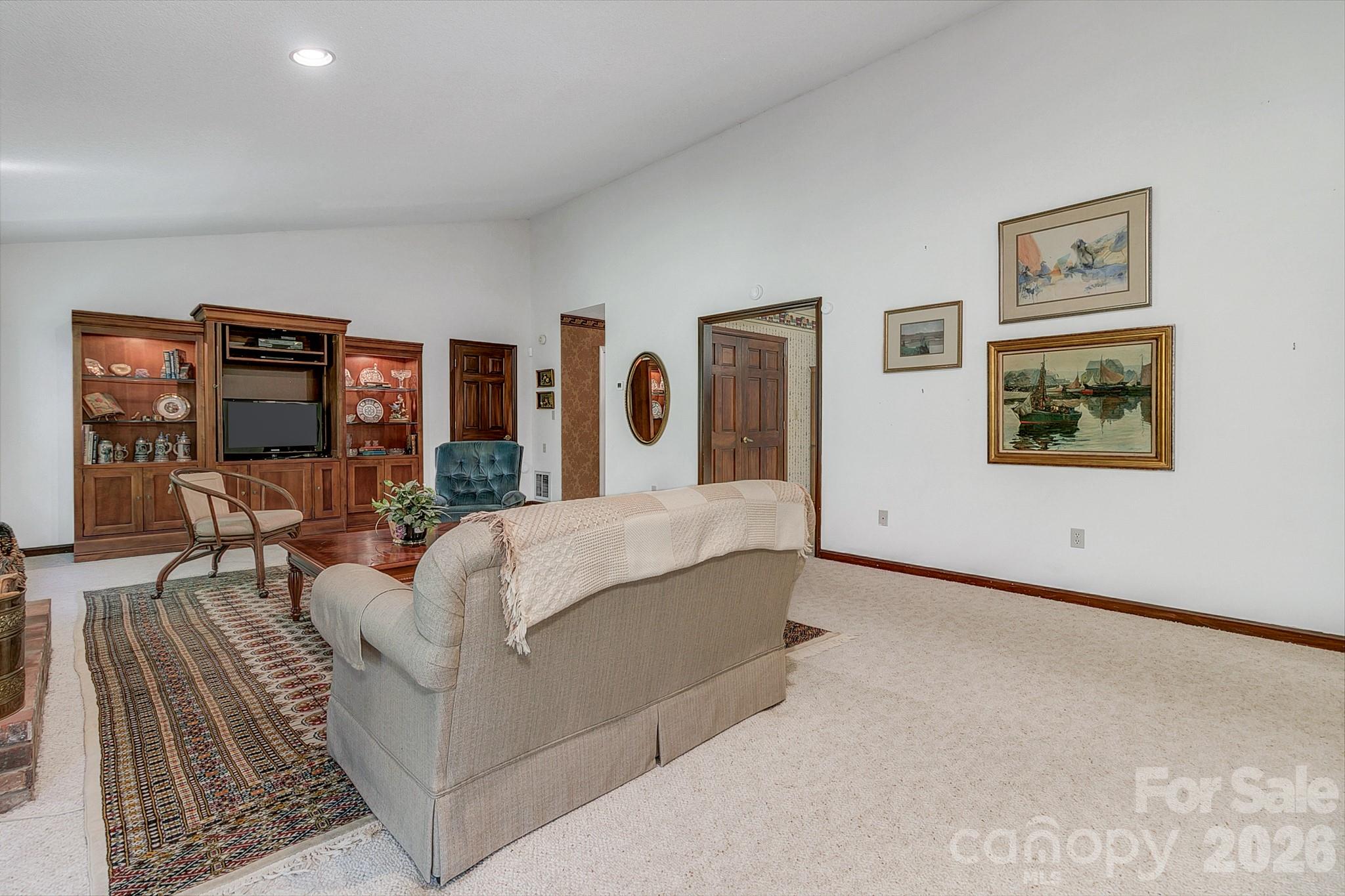 Large living room with vaulted ceilings and a gas fire place - 3111 Essex Path, Hendersonville