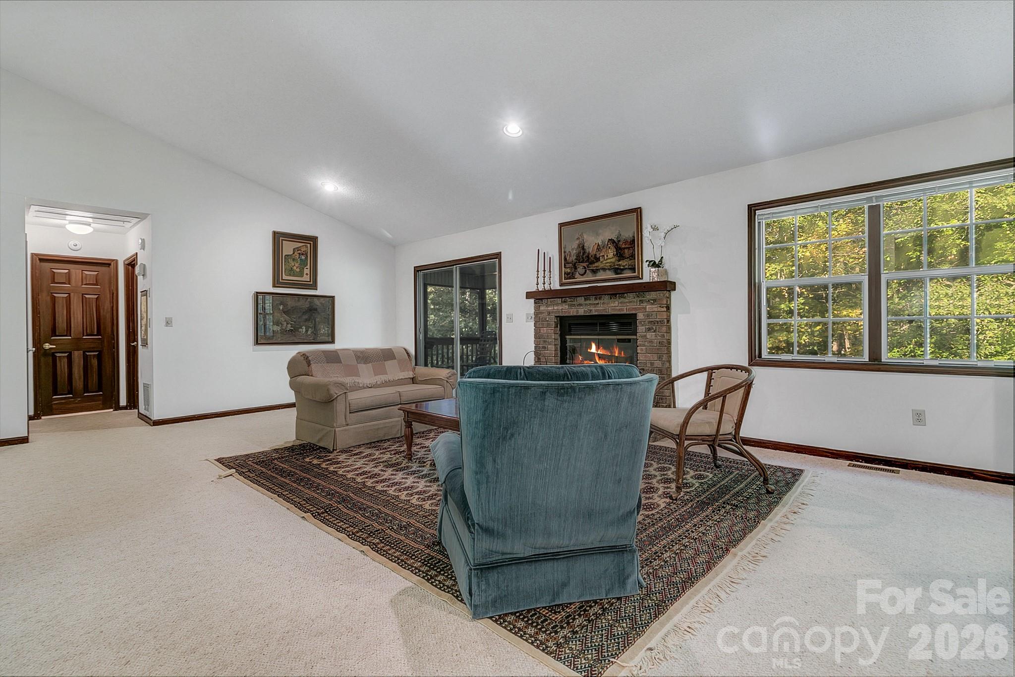 Large living room with vaulted ceilings and a gas fire place - 3111 Essex Path, Hendersonville