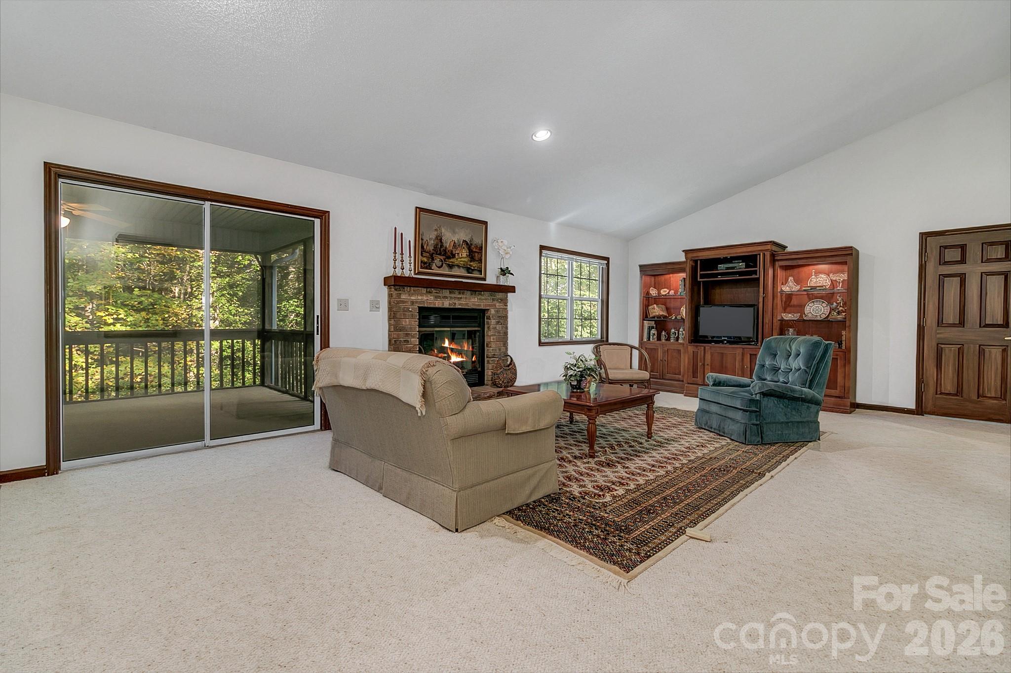Large living room with vaulted ceilings and a gas fire place - 3111 Essex Path, Hendersonville