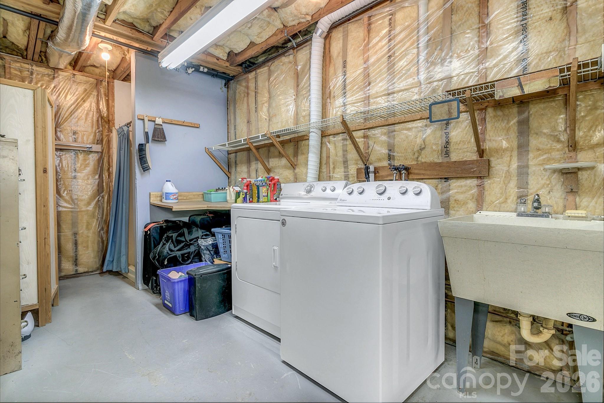 Laundry area in the basement with a toilet and a shower - 3111 Essex Path, Hendersonville