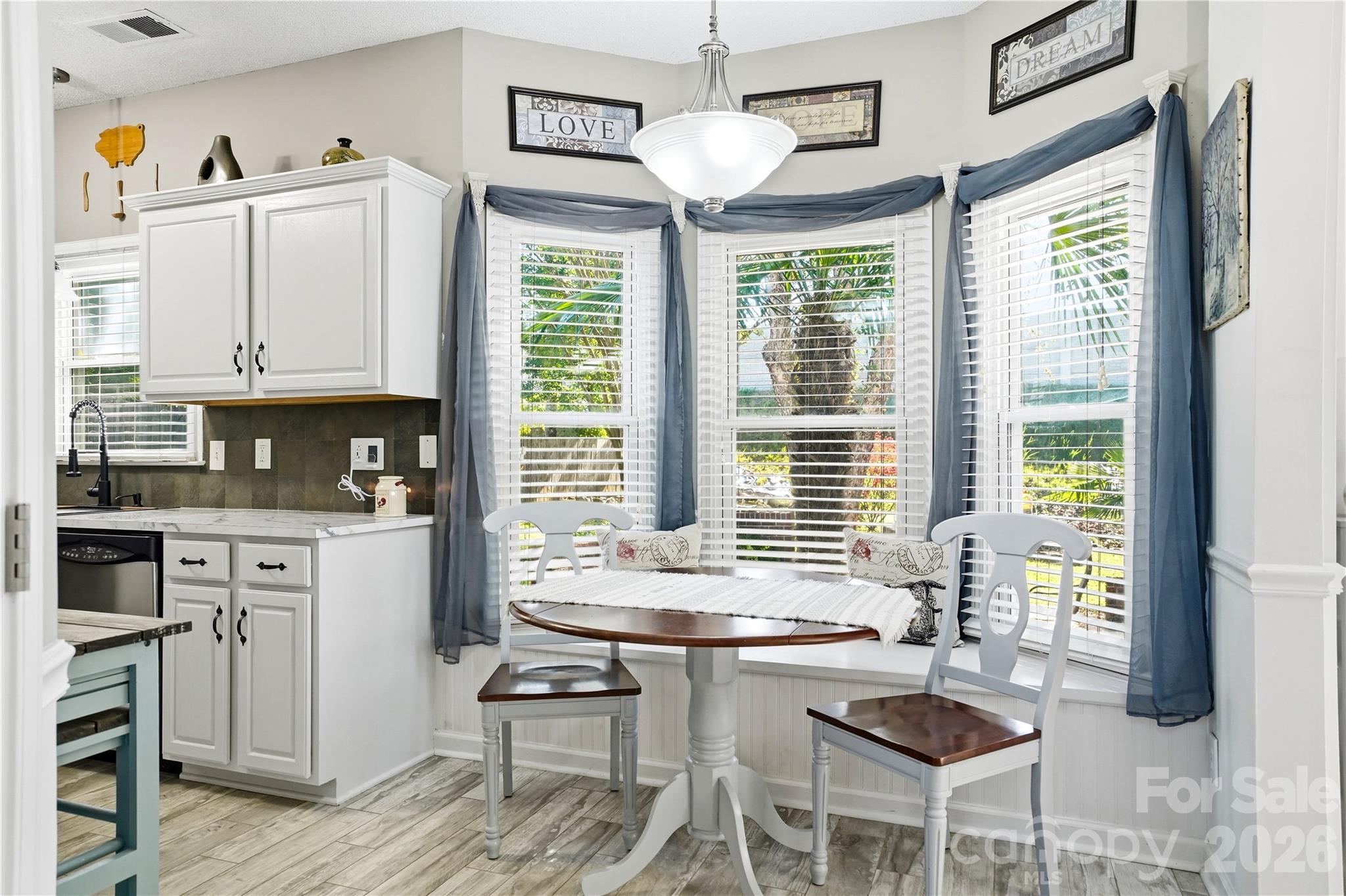 Bay window with bench seating in the breakfast nook - 119 Shining Armor Court, Mooresville