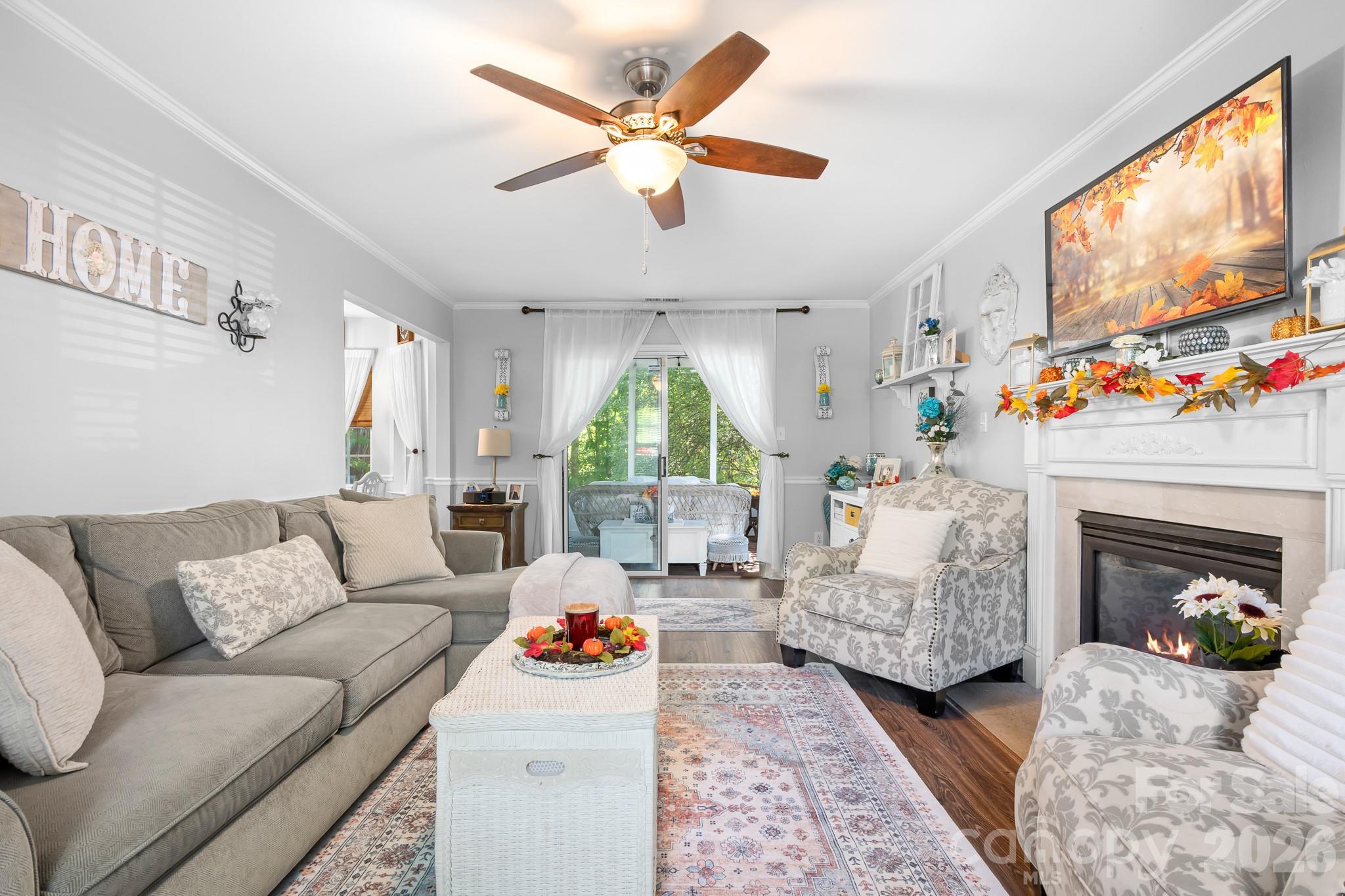 Large Famliy room with Gas Fireplace and Ceiling Fan. Solid LVP flooring throughout main living areas! - 4126 Medford Drive NW, Concord
