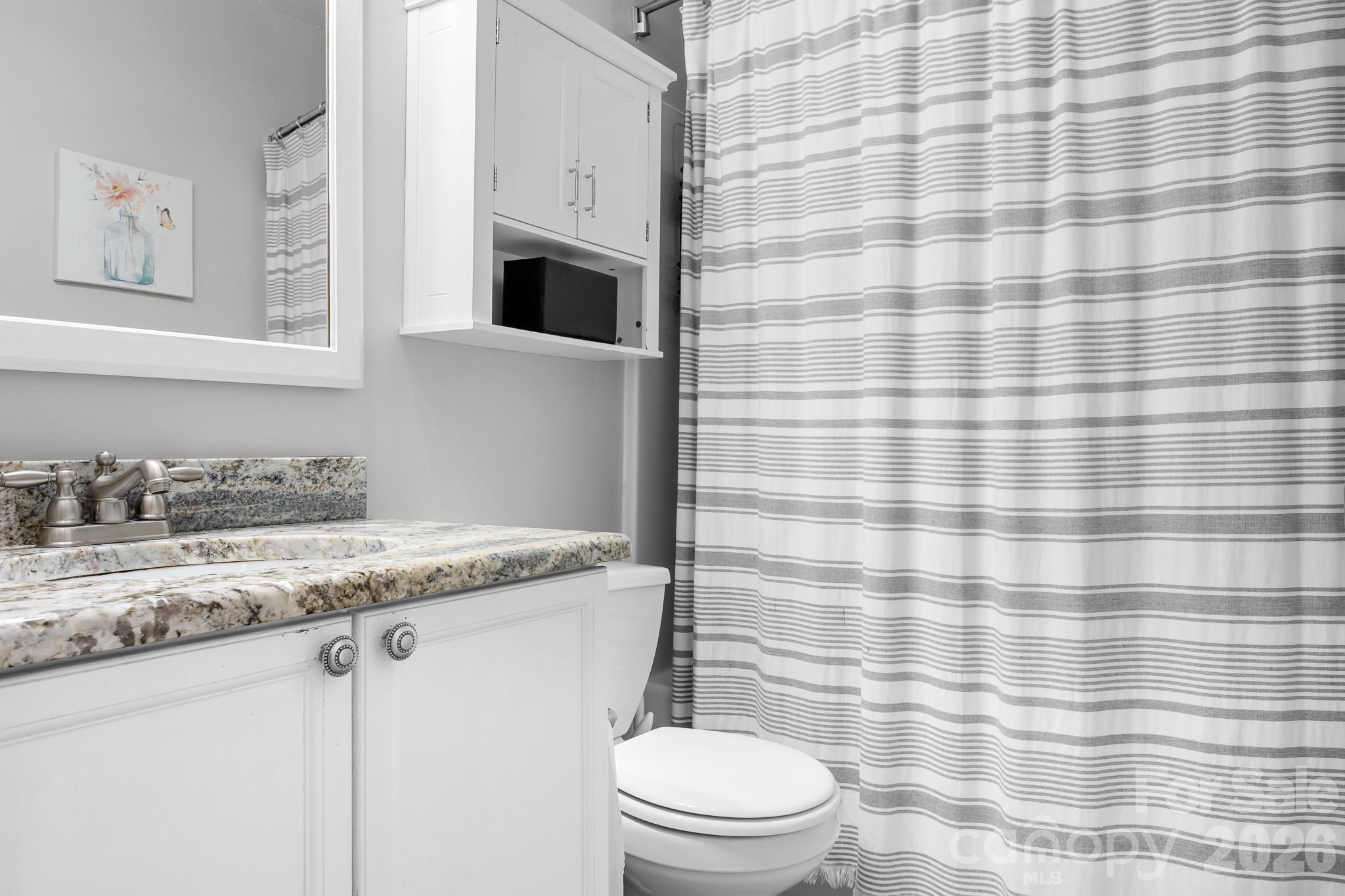 Hall Full bath for your guest rooms. Granite Countertop and framed mirror.  Shower/Tub great for bathing children or pets! - 4126 Medford Drive NW, Concord