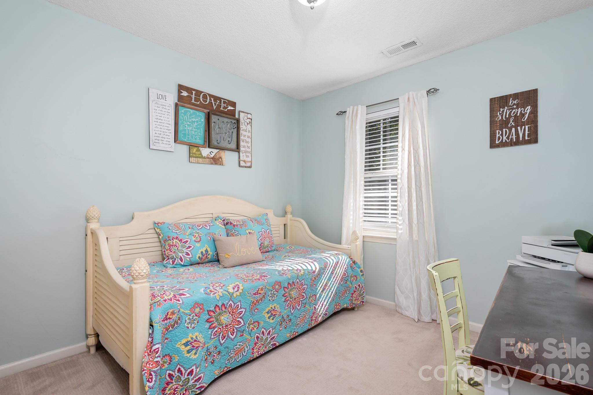 Bedroom #2 with window and a soft blue paint color. Very serene and relaxing. - 4126 Medford Drive NW, Concord