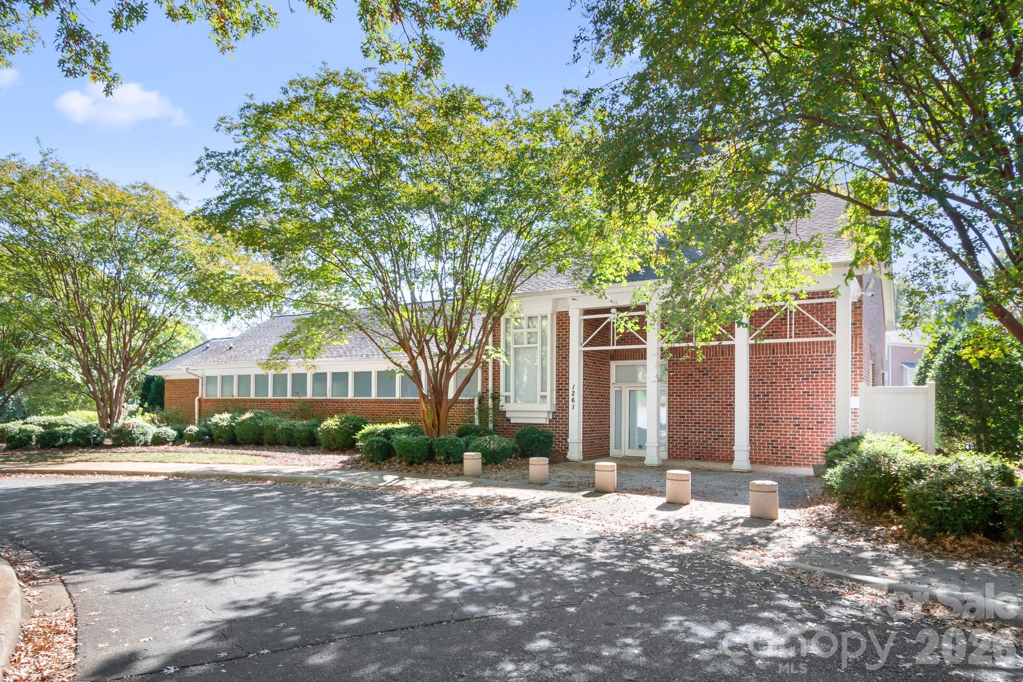 Clubhouse at front of neighbhorhood. Lots of planned activities throughout the year.  Residents can also use the space for private events. - 4126 Medford Drive NW, Concord