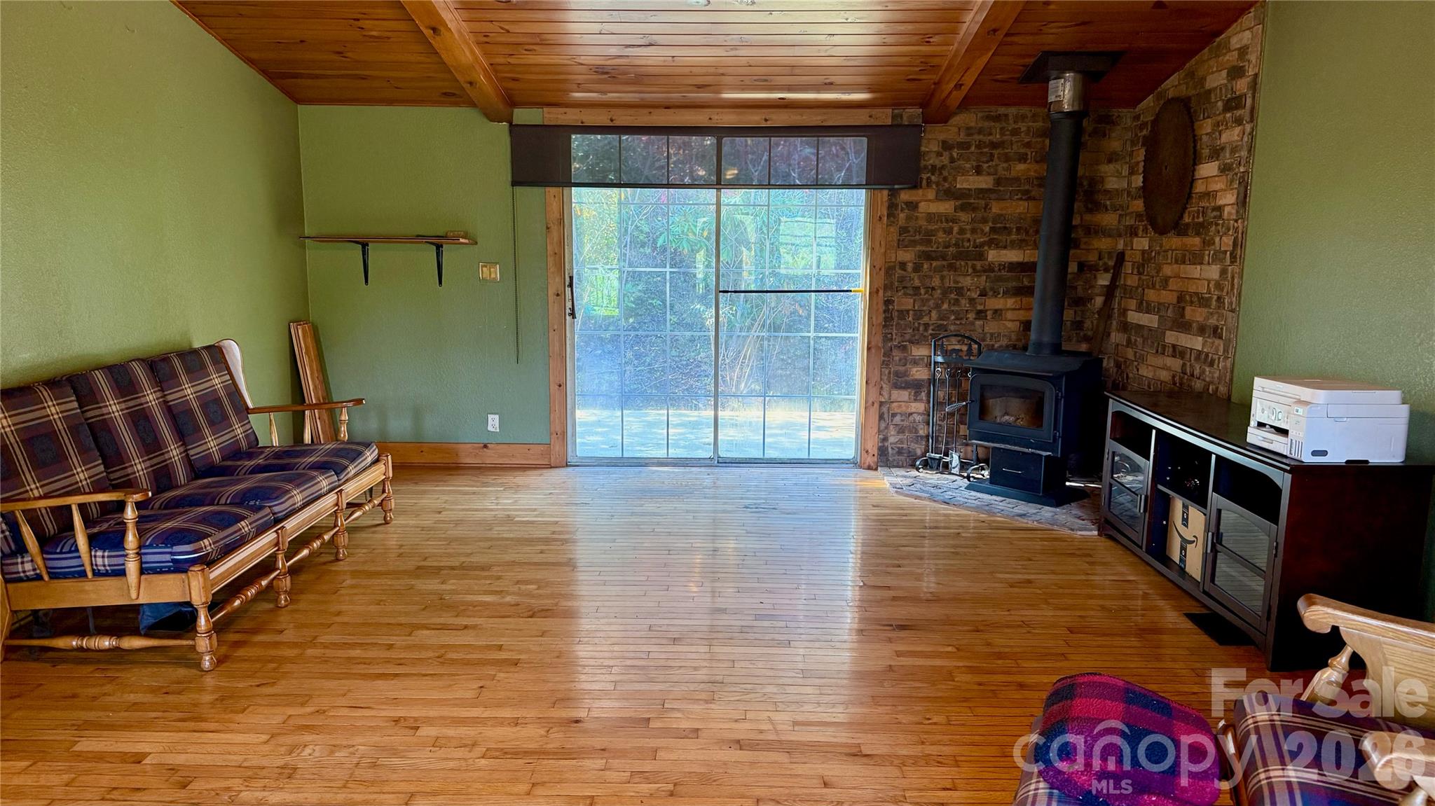 Spacious living area from the front of the house, looking toward the back. - 898 Rock Creek Road, Burnsville