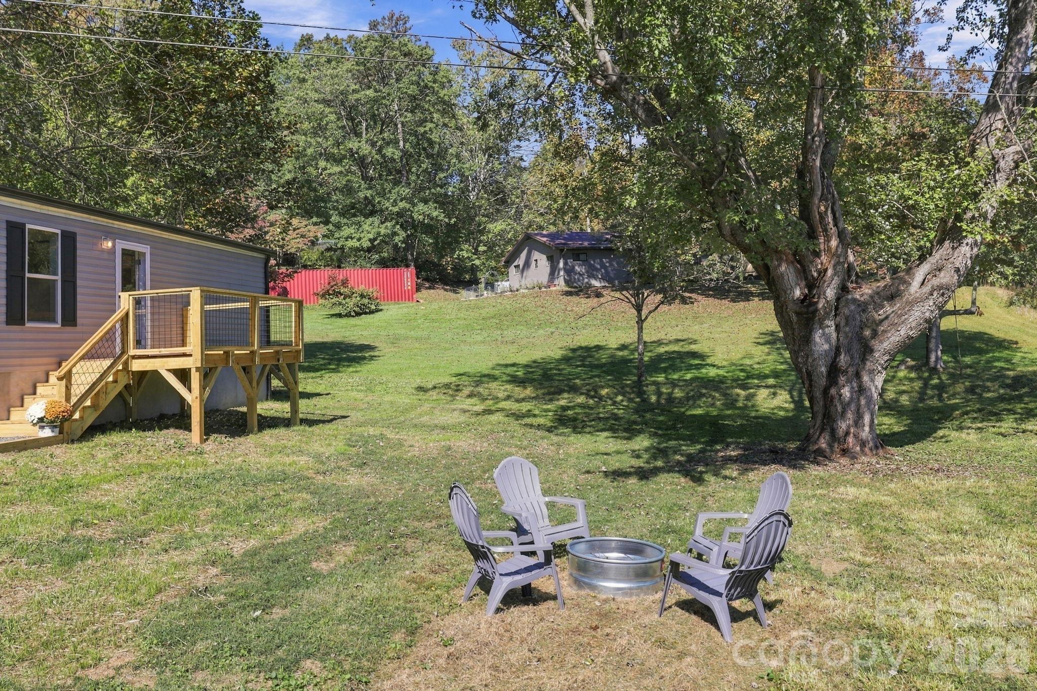 Enjoy evenings by the fire pit. - 85 Trent Road, Brevard