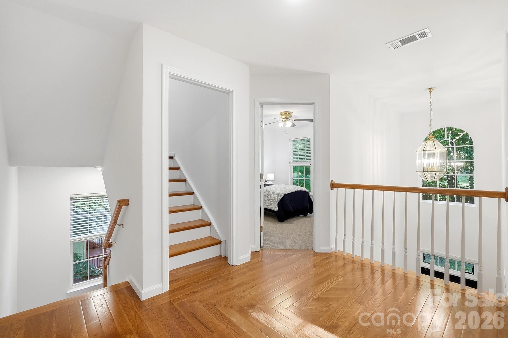Beautiful hardwoods continue in the landing and hall - 2100 Pineapple Court, Matthews