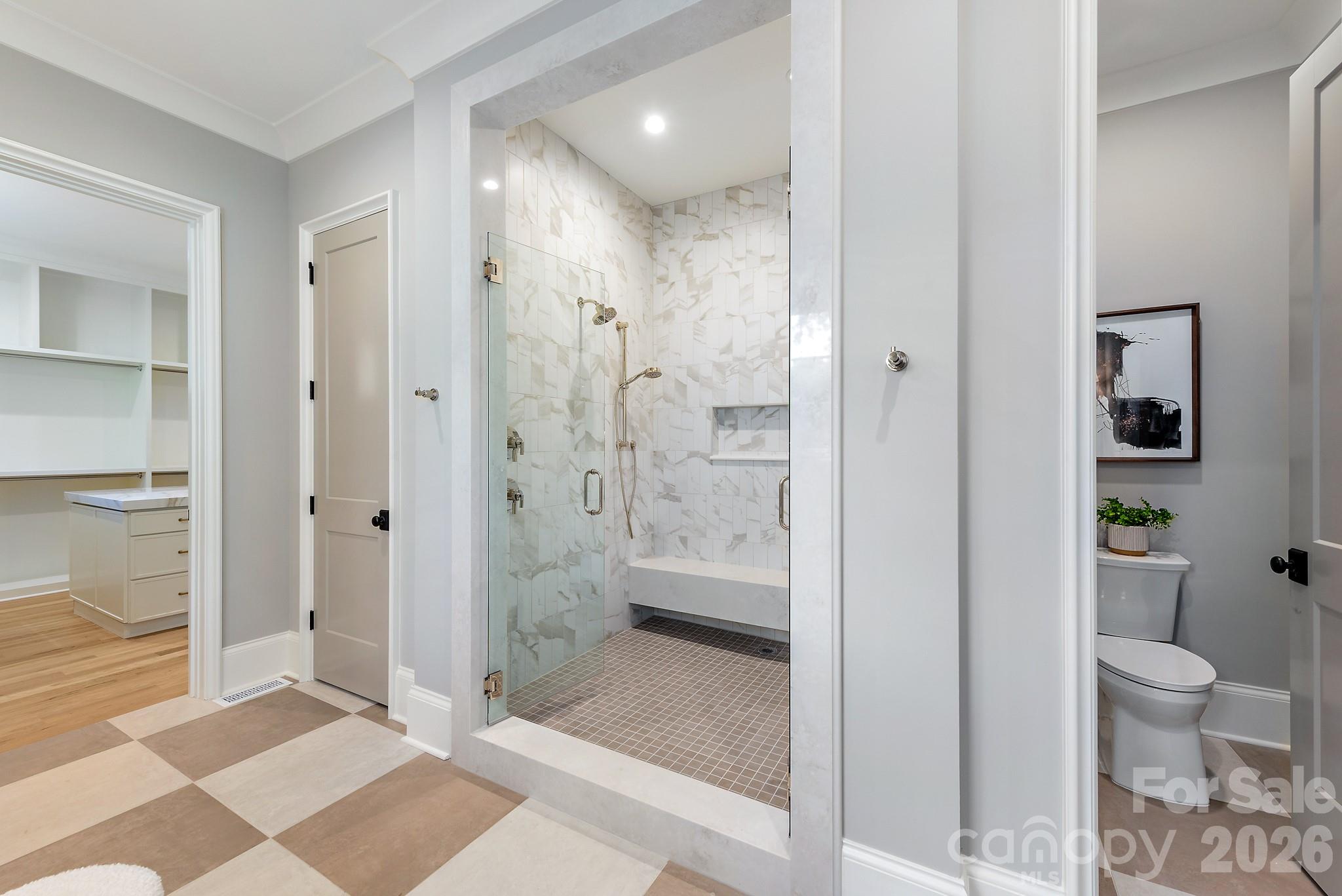 Main level primary suite with walk in shower. - 133 Wonderwood Drive, Charlotte