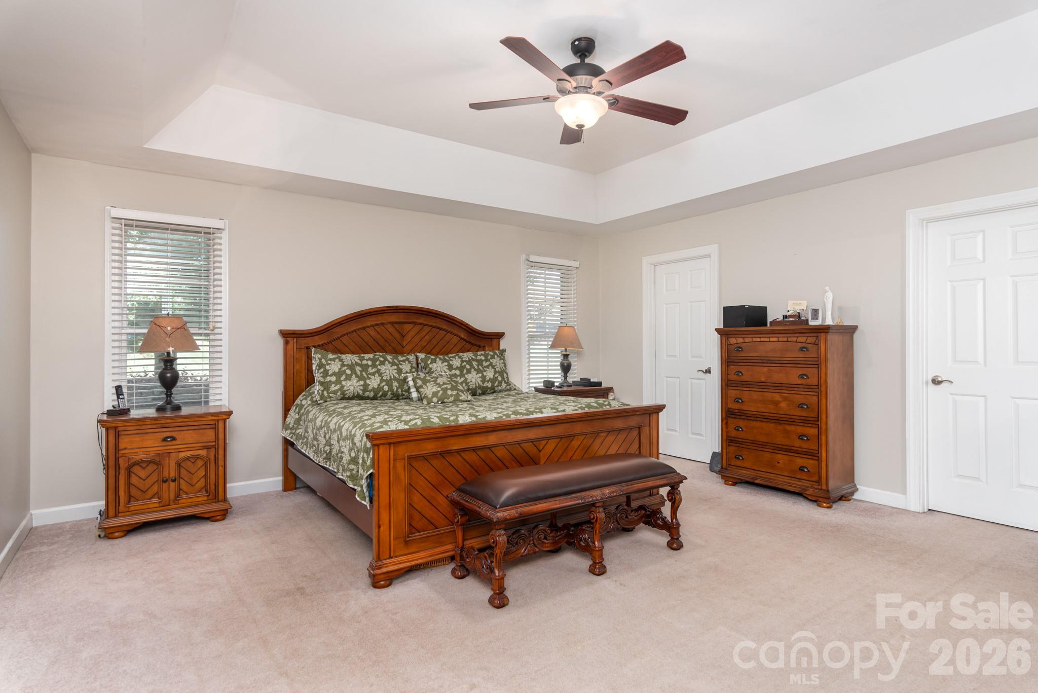 Large primary bedroom with tray ceiling and 2 walk in closets - 2915 Woodfield Lane, Lincolnton