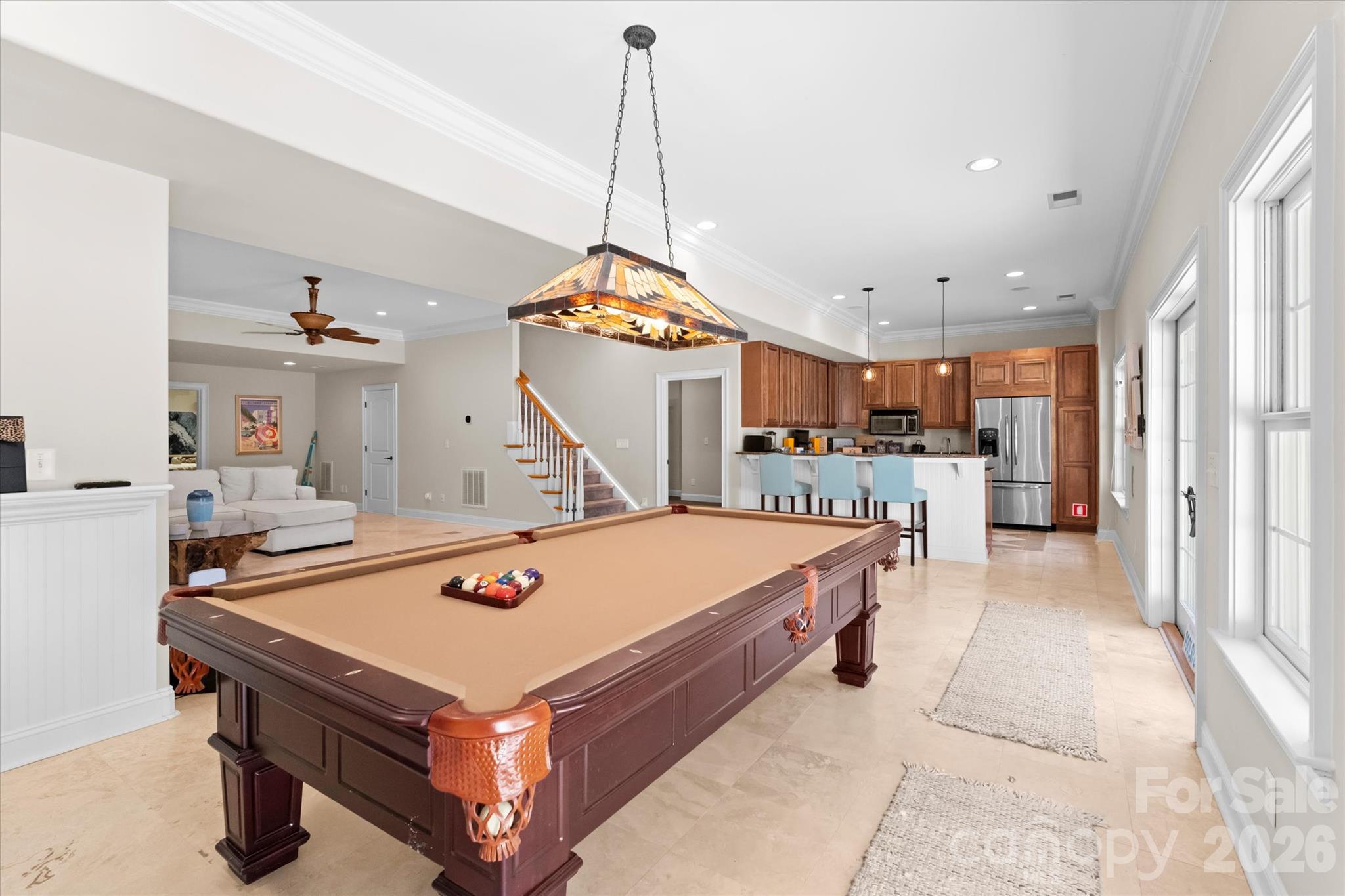 Basement billiards space with kitchen and walk-out to pool - 4552 Sawgrass Court, Denver