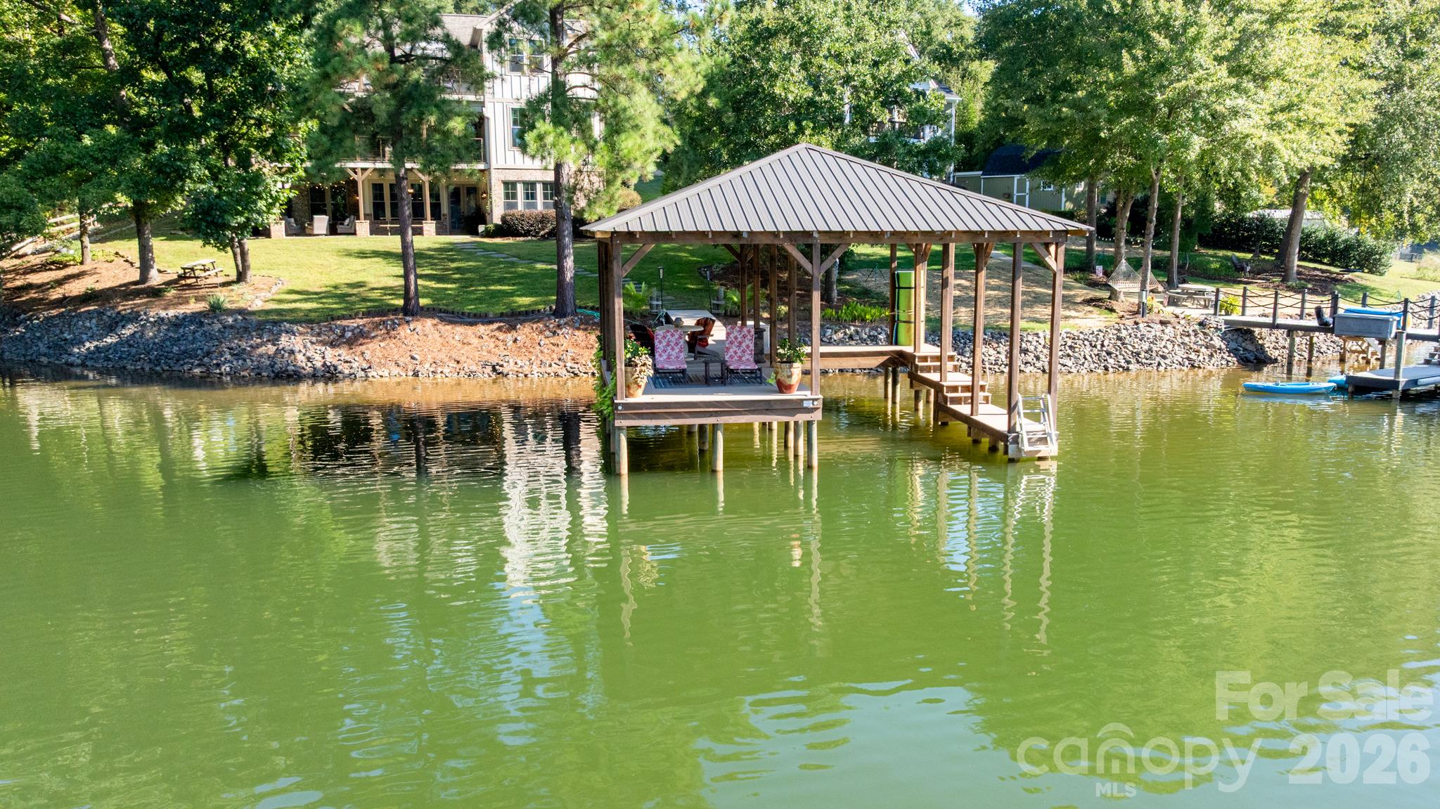 The stabalized & covered dock with steps off the dock to make loading your boat or kayak easy! - 1285 Saunders Drive, Catawba